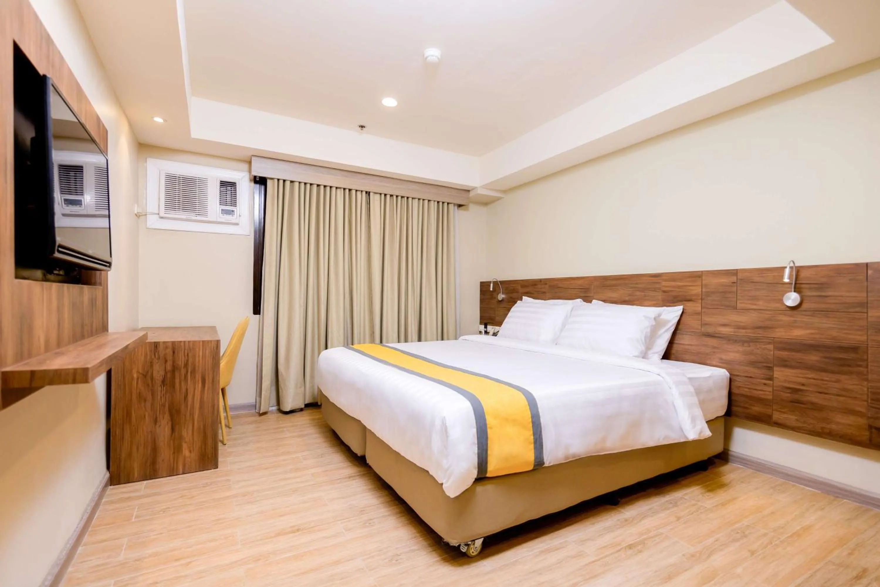 Bedroom, Bed in SureStay Plus by Best Western Cebu City