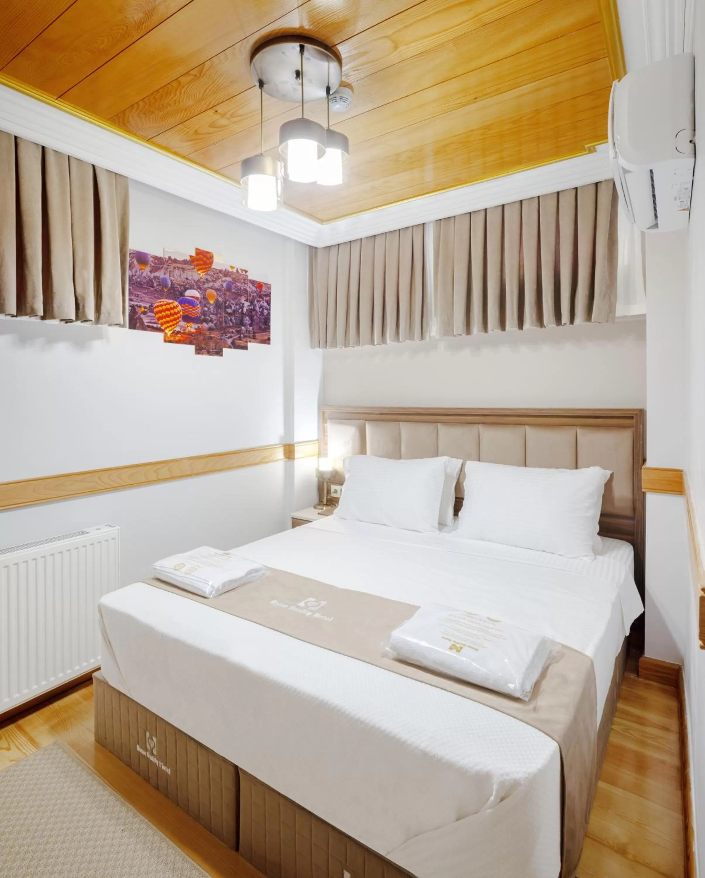 Bed in HOME QUALITY HOTEL