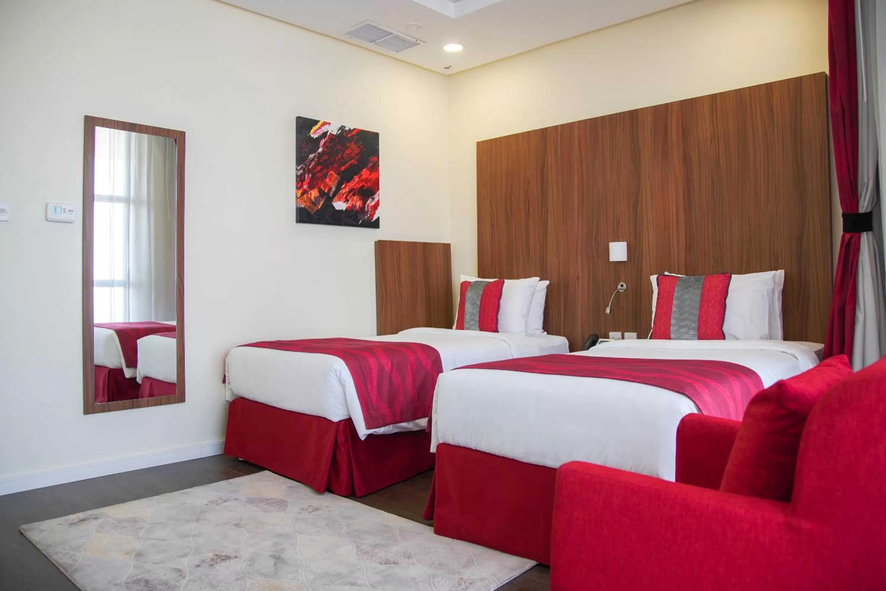 Bed in Ramada Encore by Wyndham Kuwait Downtown