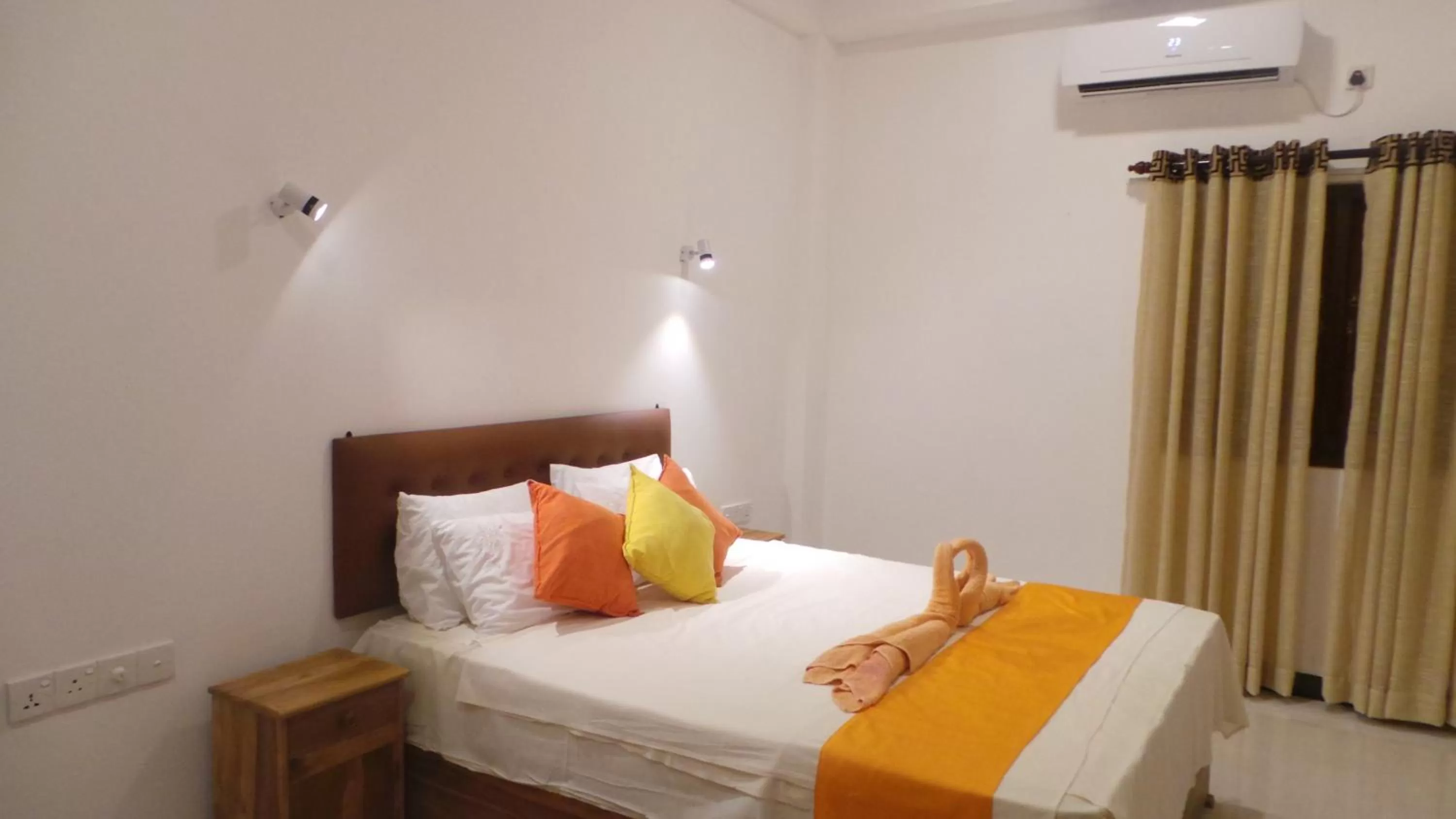 Bed in WindMill Beach Villa and Hotel