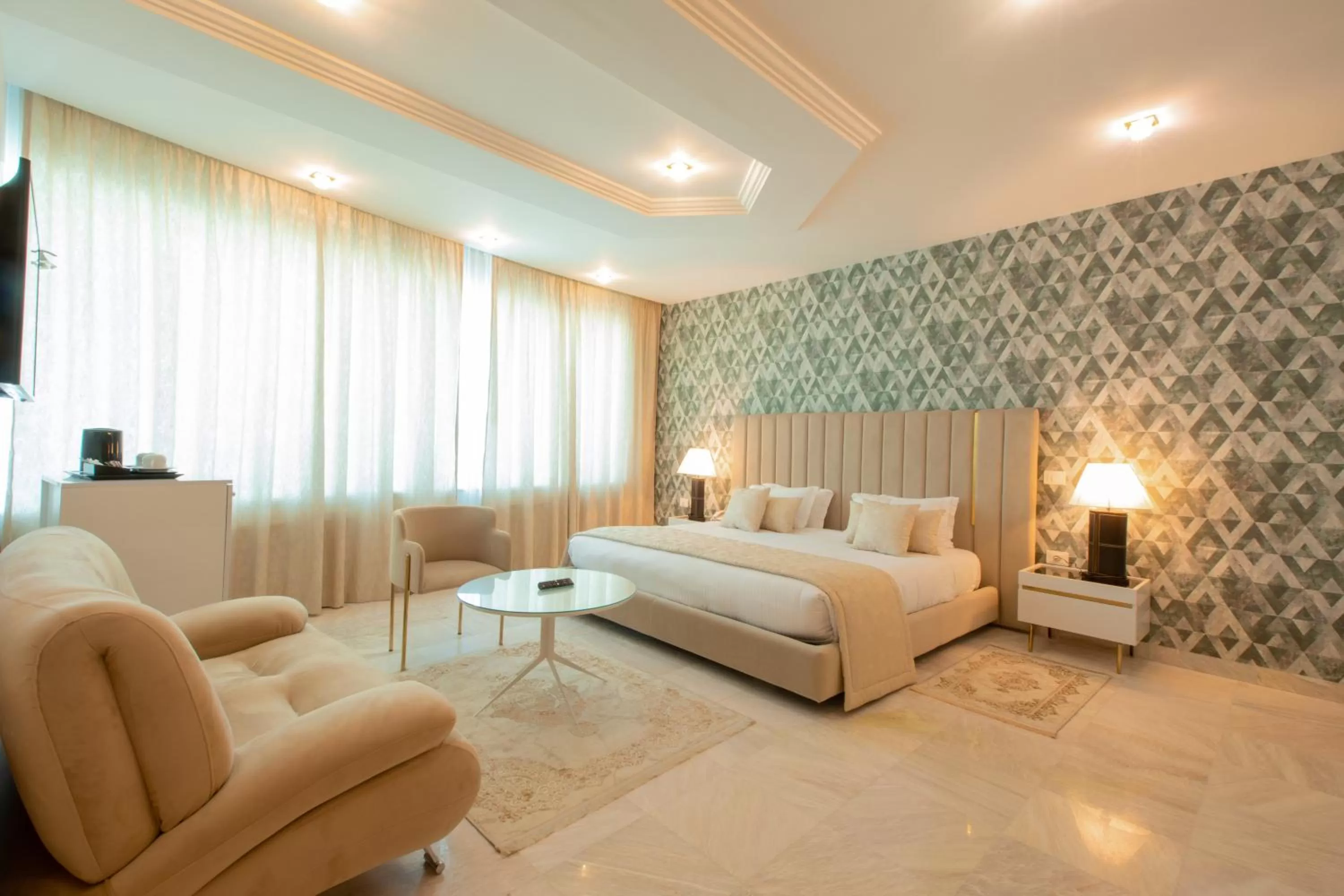 Bed in The Penthouse Suites Hotel