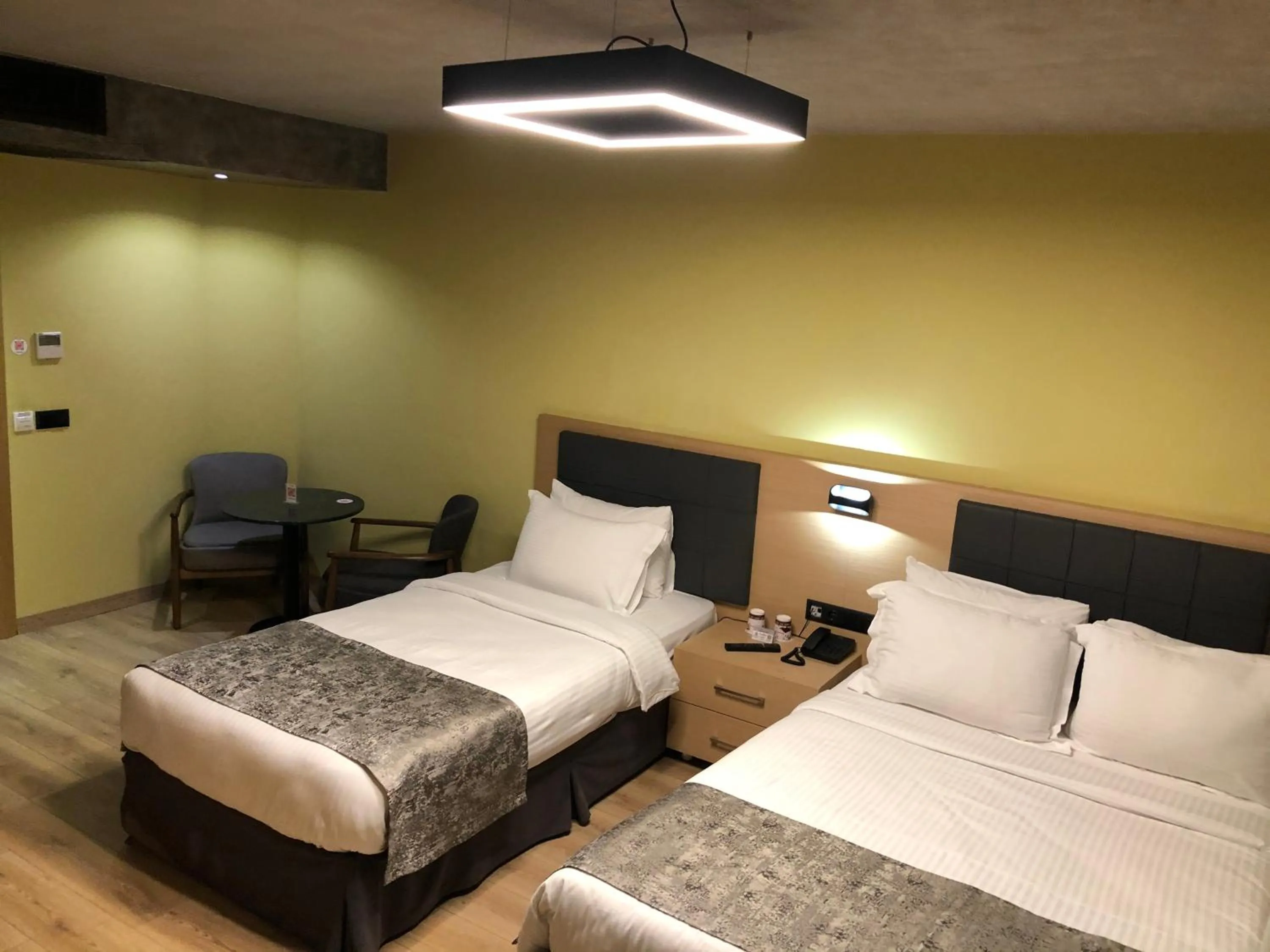 Bed in Red Stone Hotel