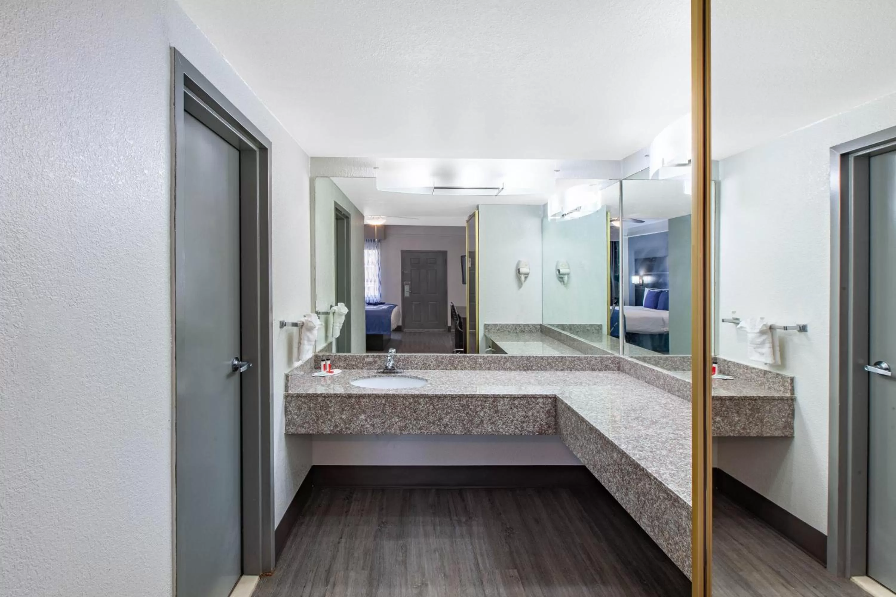 Bathroom in Days Inn & Suites by Wyndham Webster NASA-ClearLake-Houston
