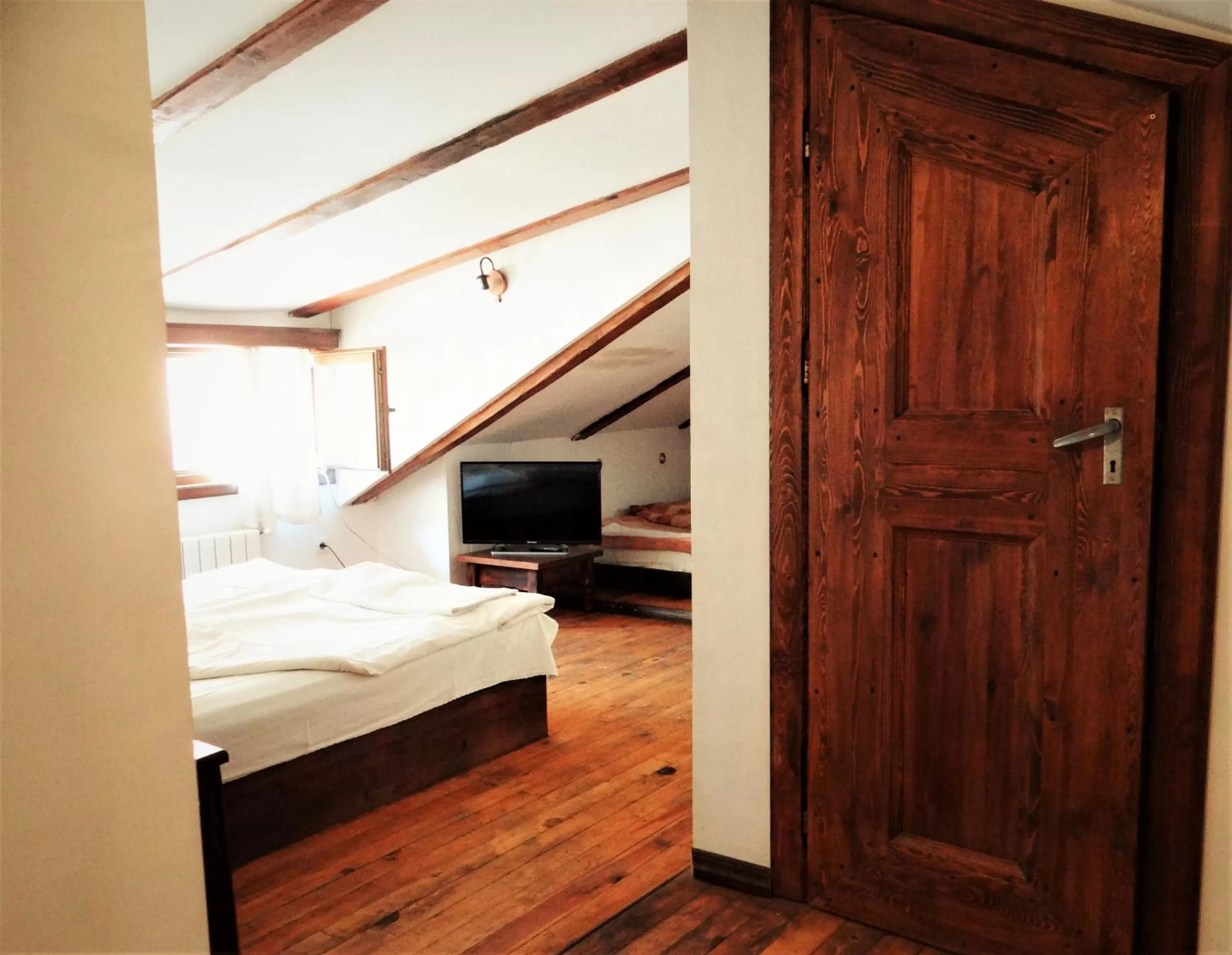 Bed in The Old House Family Hotel