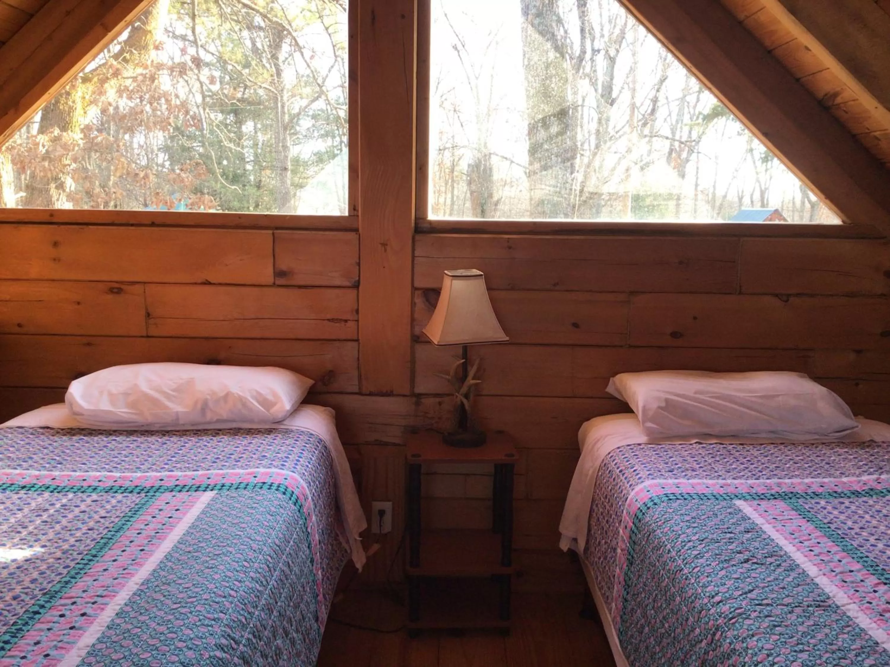 Bed in Kozy Haven Log Cabin Rentals