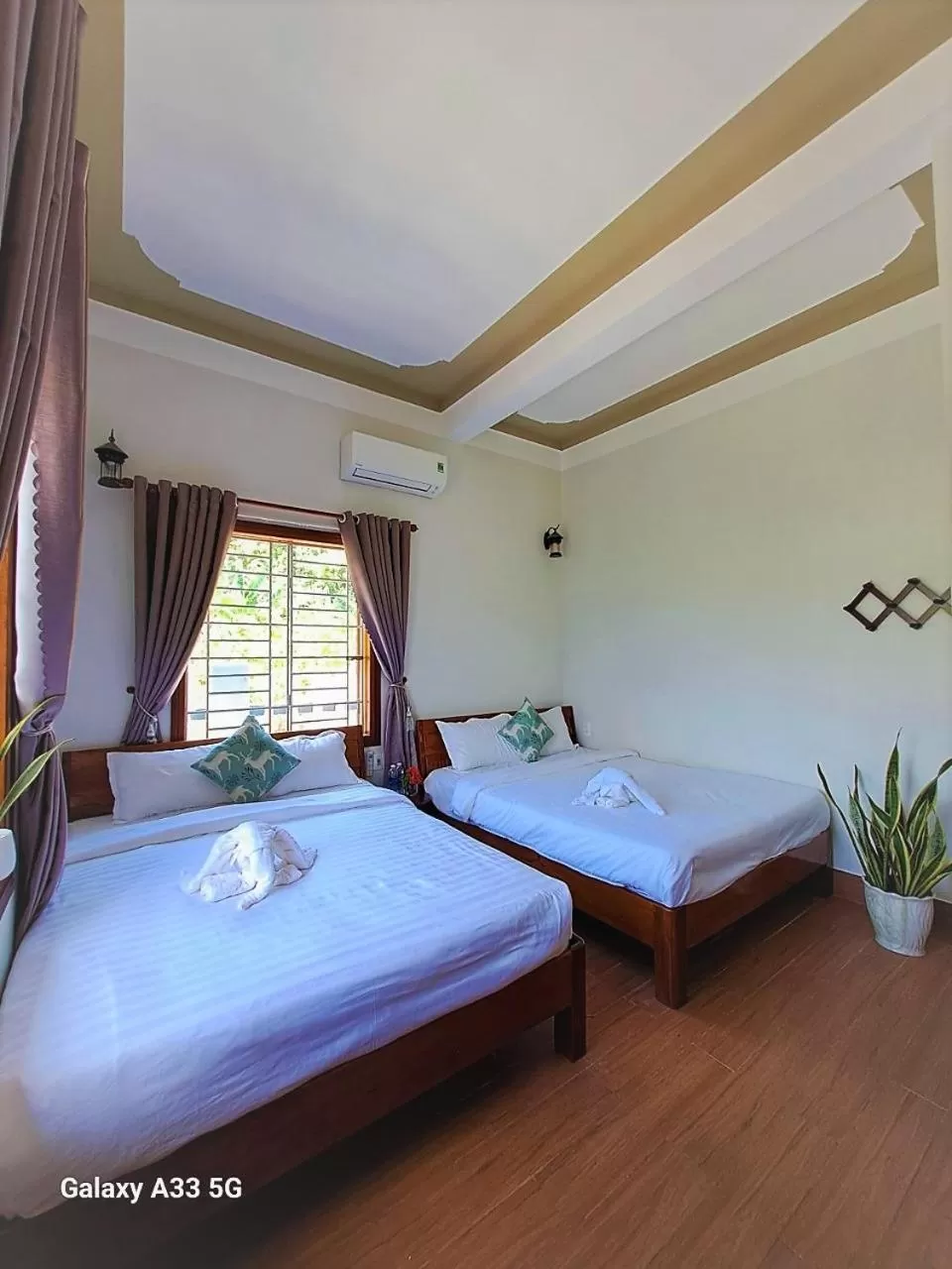Photo of the whole room, Bed in Cong Man Homestay Cham Island