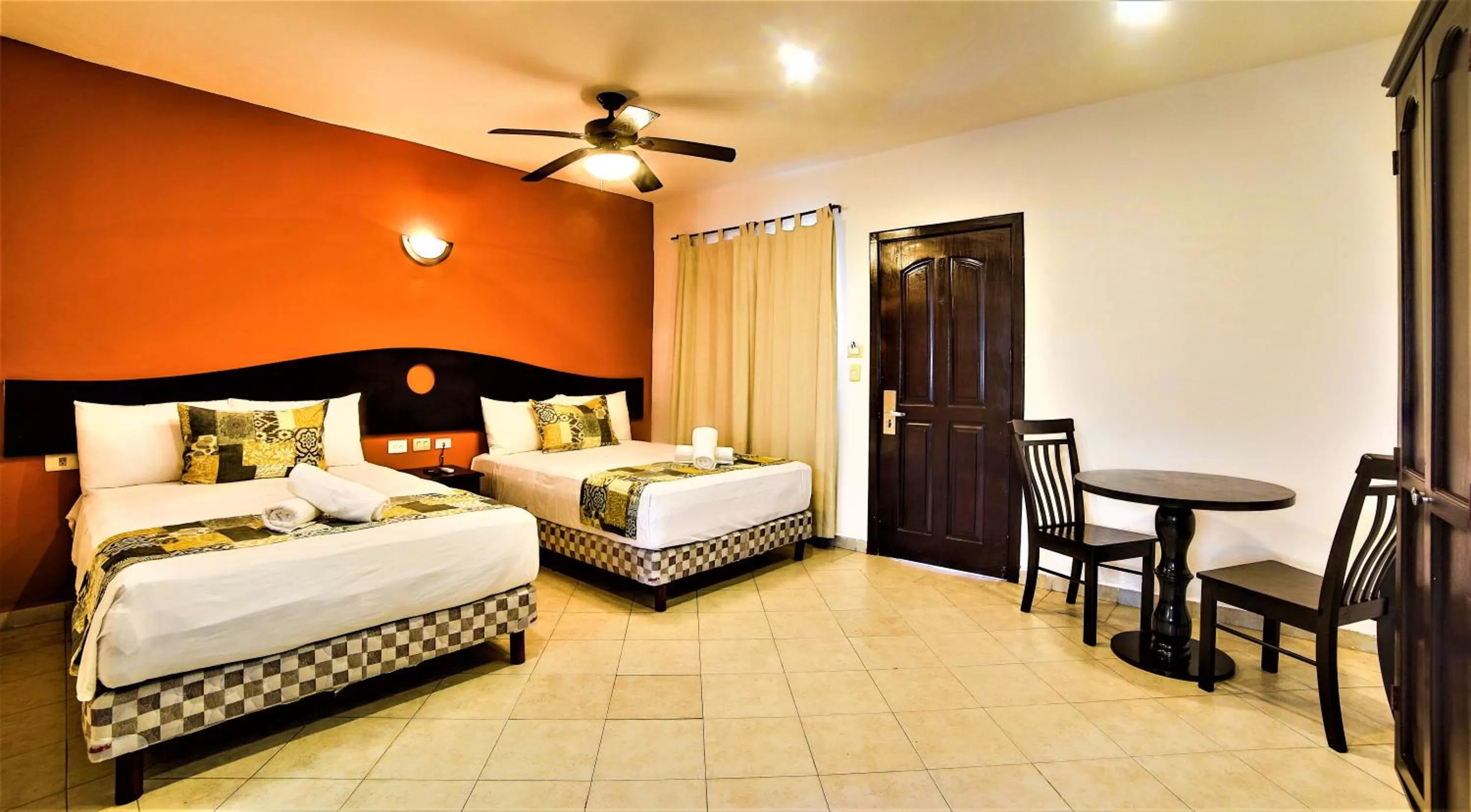 Photo of the whole room, Bed in Hotel Colonial Playa del Carmen