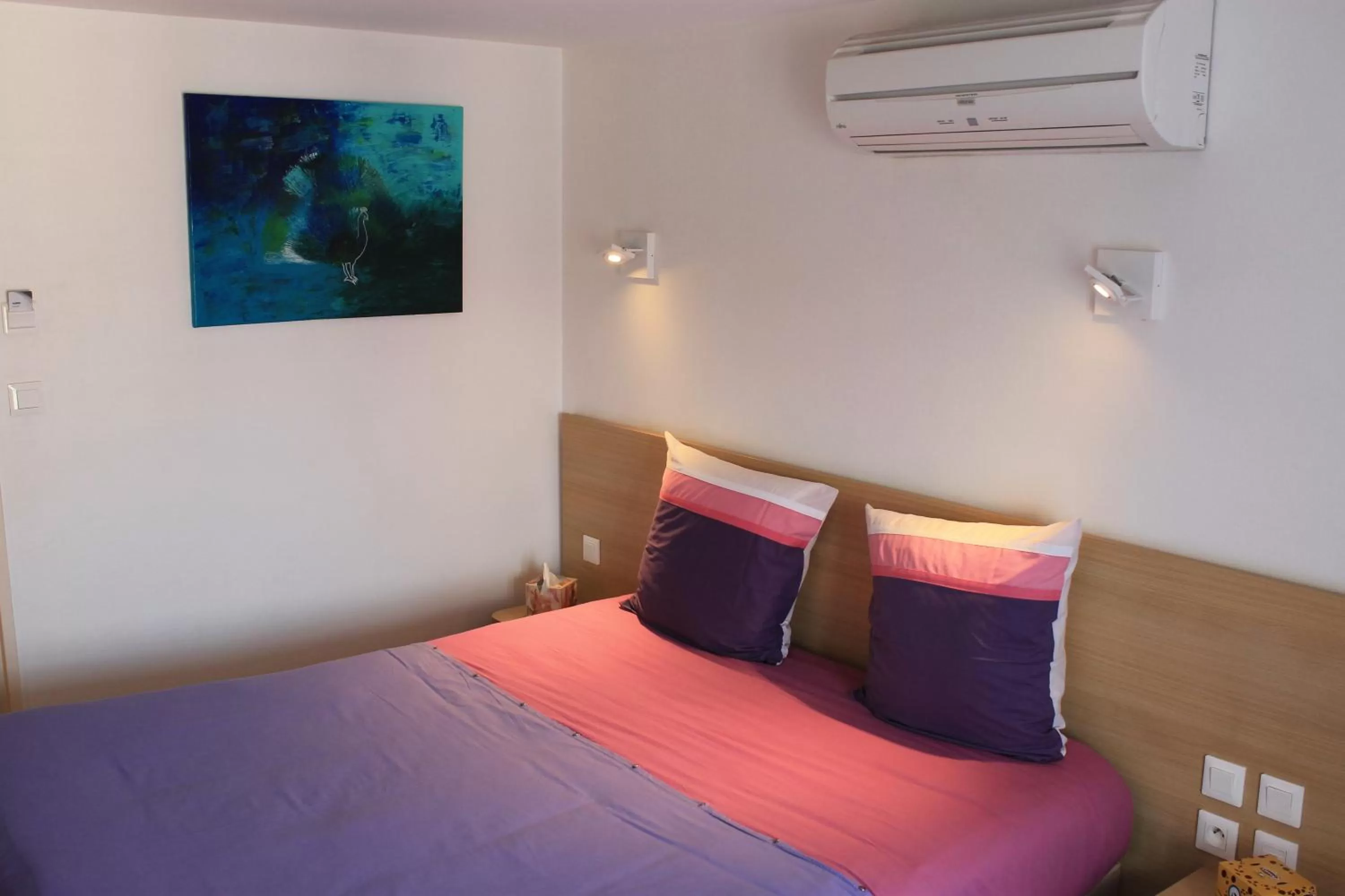 Bed in Hôtel du lion d'or