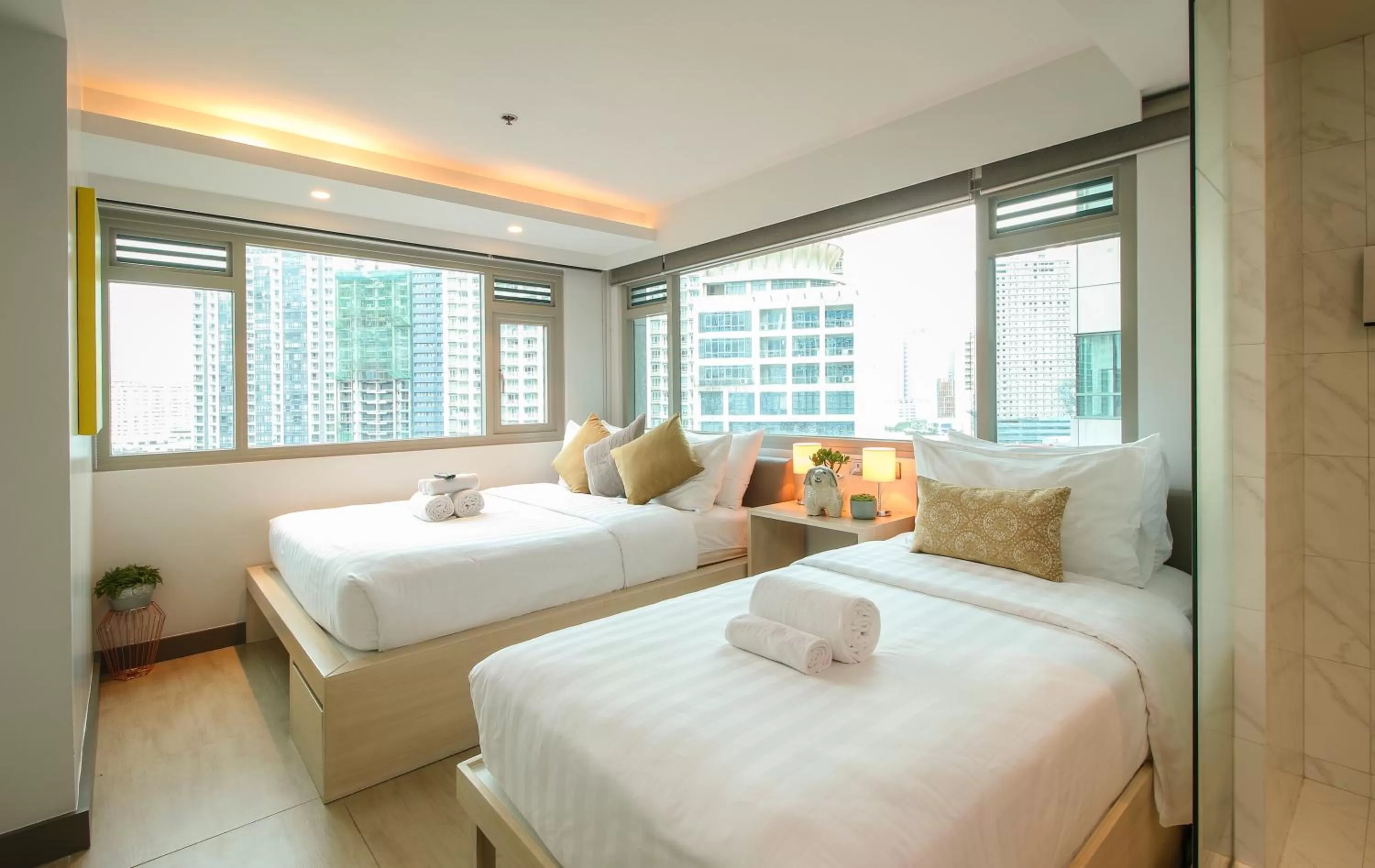Bed in The Mini Suites Eton Tower Makati