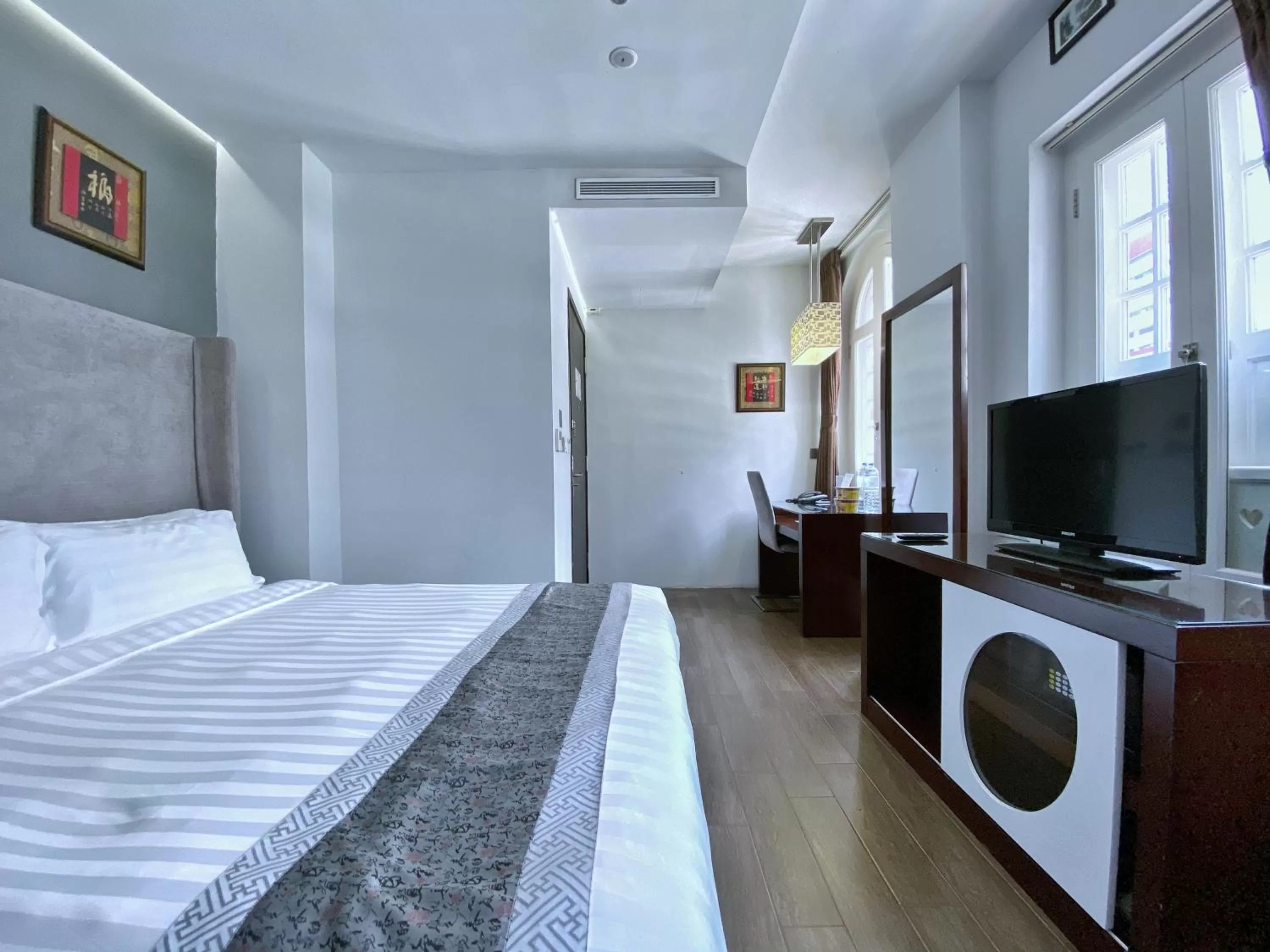 Bed in Bliss Hotel Singapore