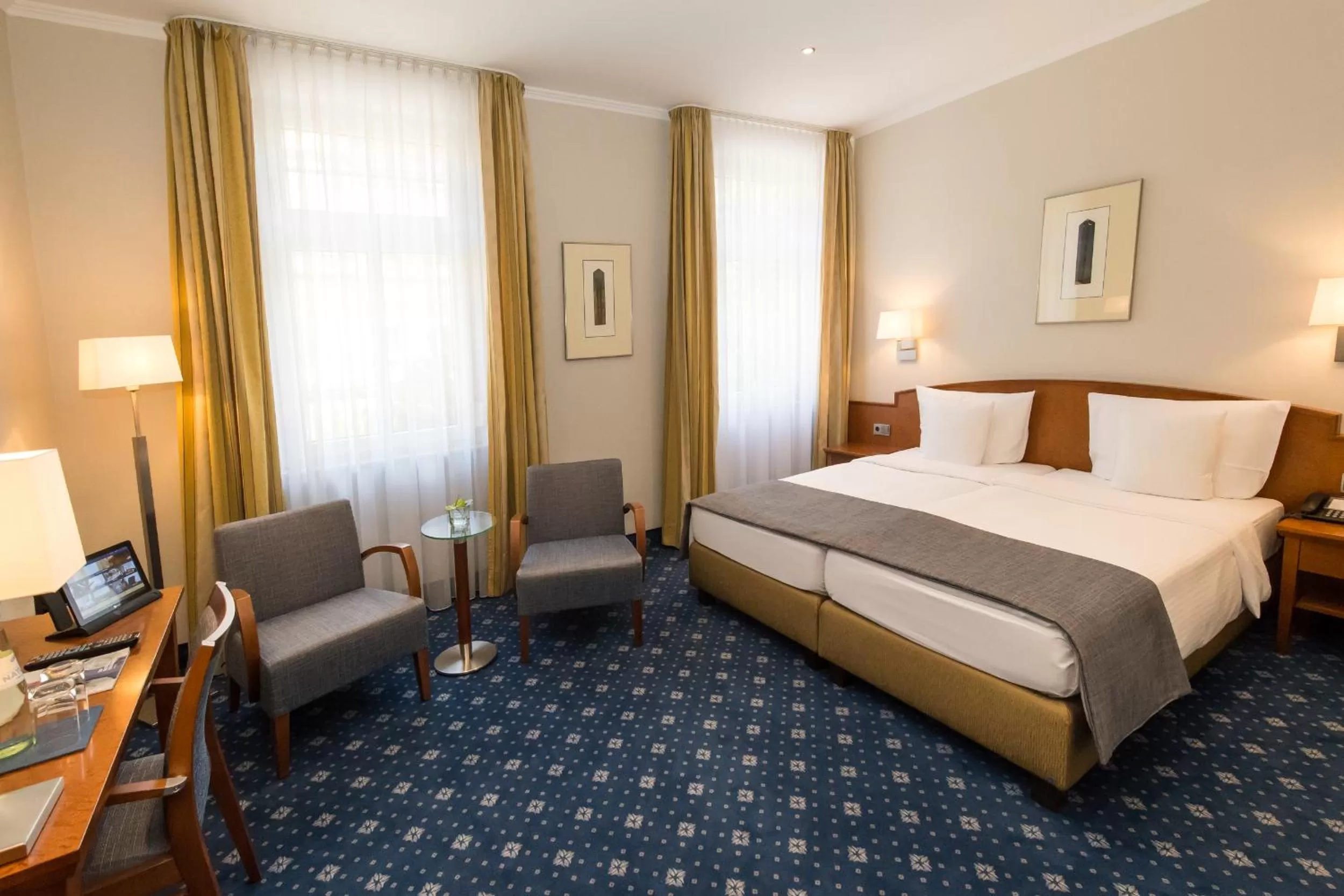 Photo of the whole room, Bed in Hotel Oranien Wiesbaden