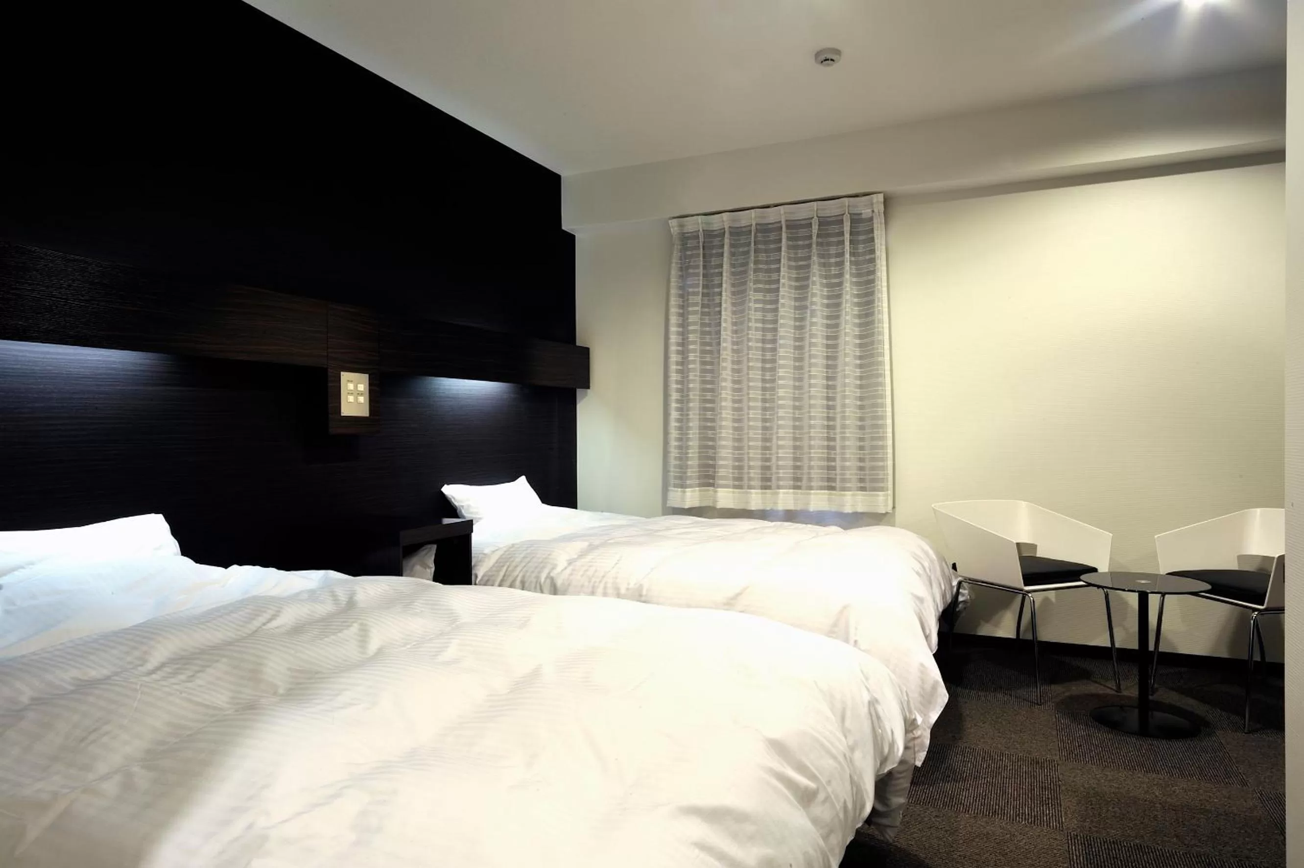 Bed in Green Rich Hotel Iwakuni Ekimae (Artificial hot spring Futamata Yunohana)