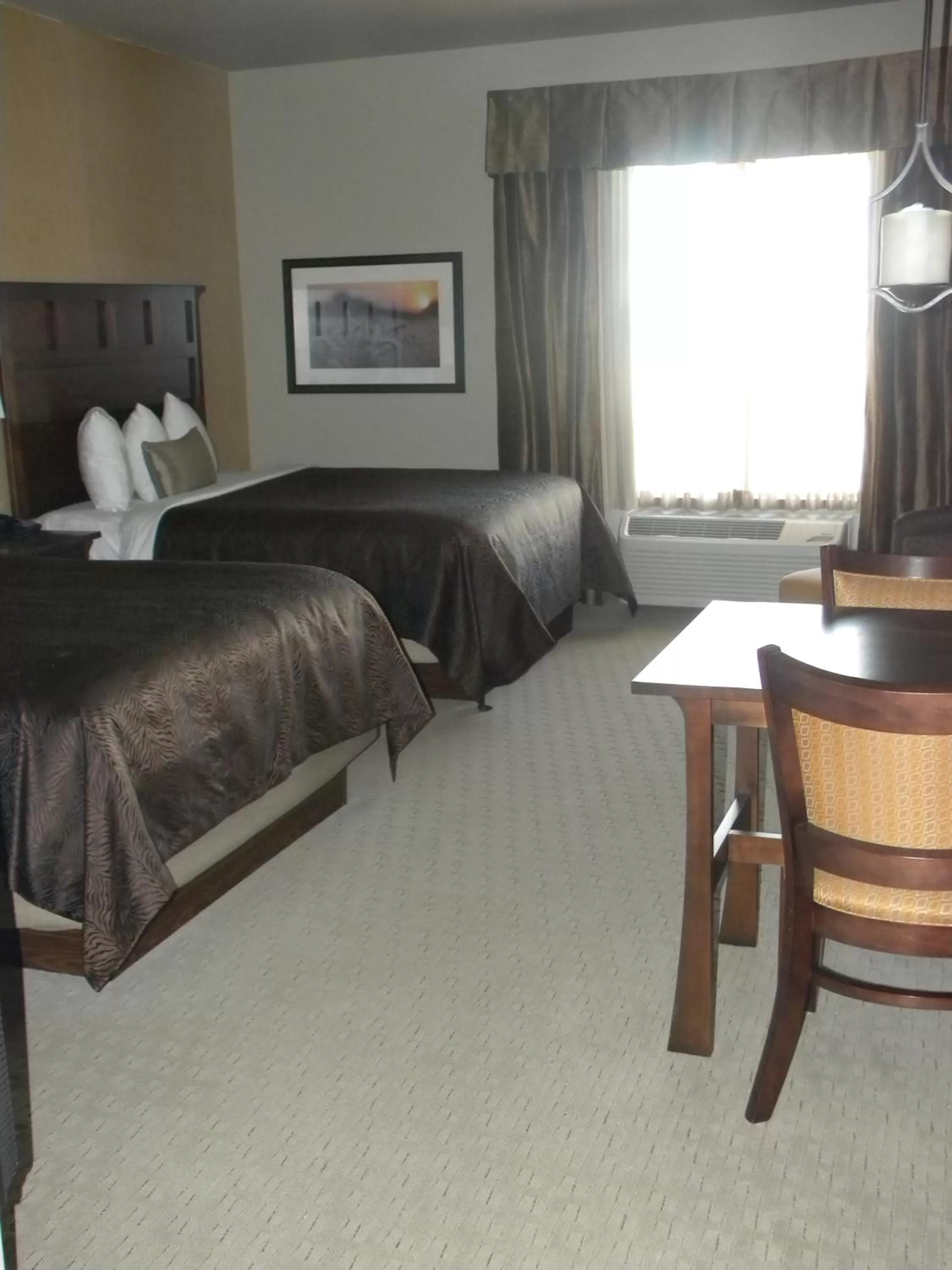 Bed in Teddy's Residential Suites Watford City
