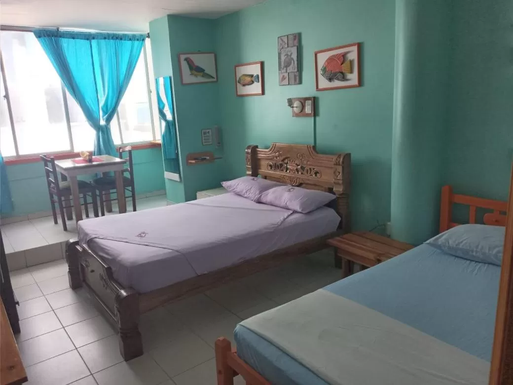 Photo of the whole room, Bed in Hotel Pueblito Playa