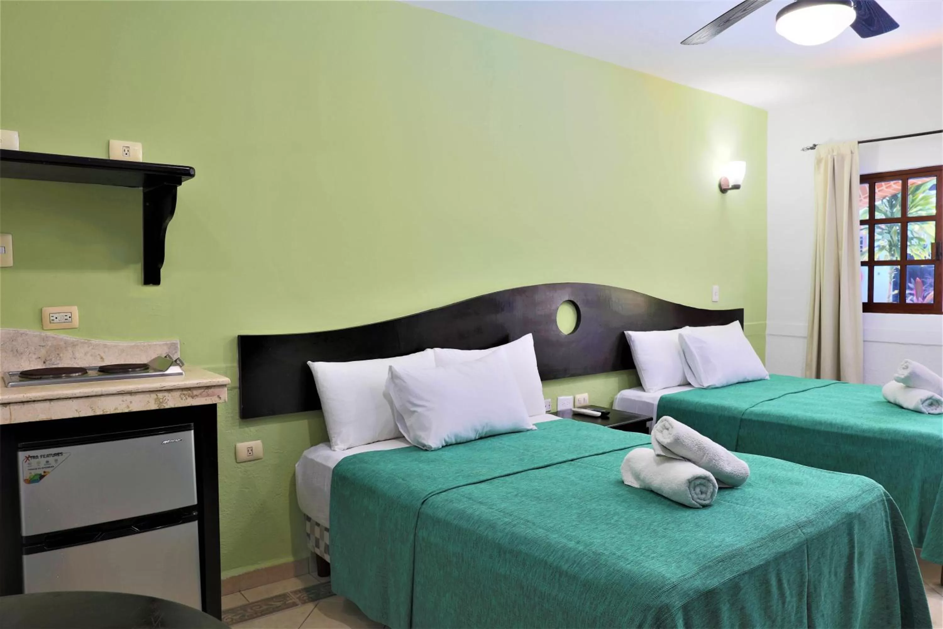 Photo of the whole room, Bed in Hotel Colonial Playa del Carmen