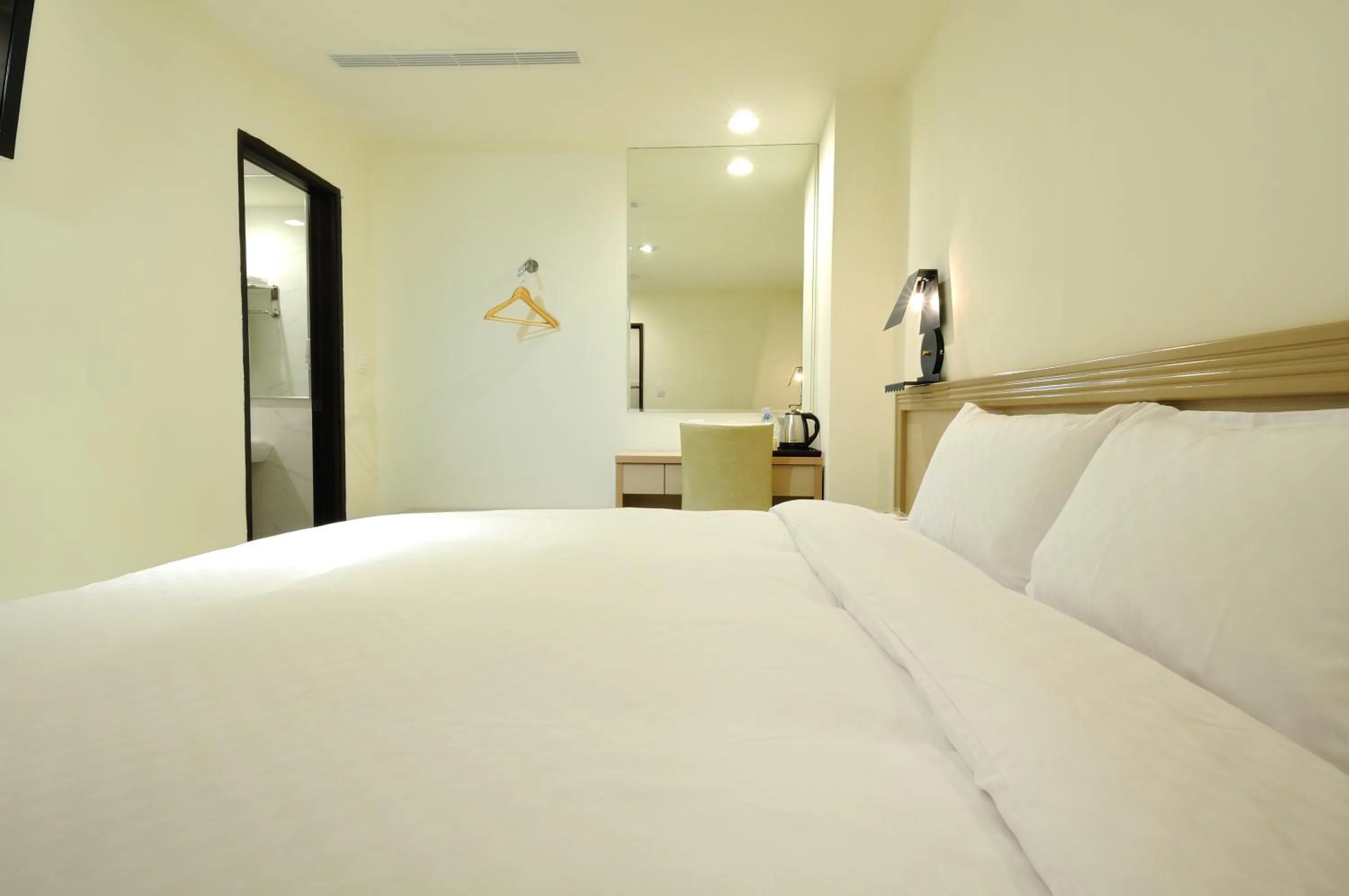 Bed in 安可旅店 Bravo Hotel