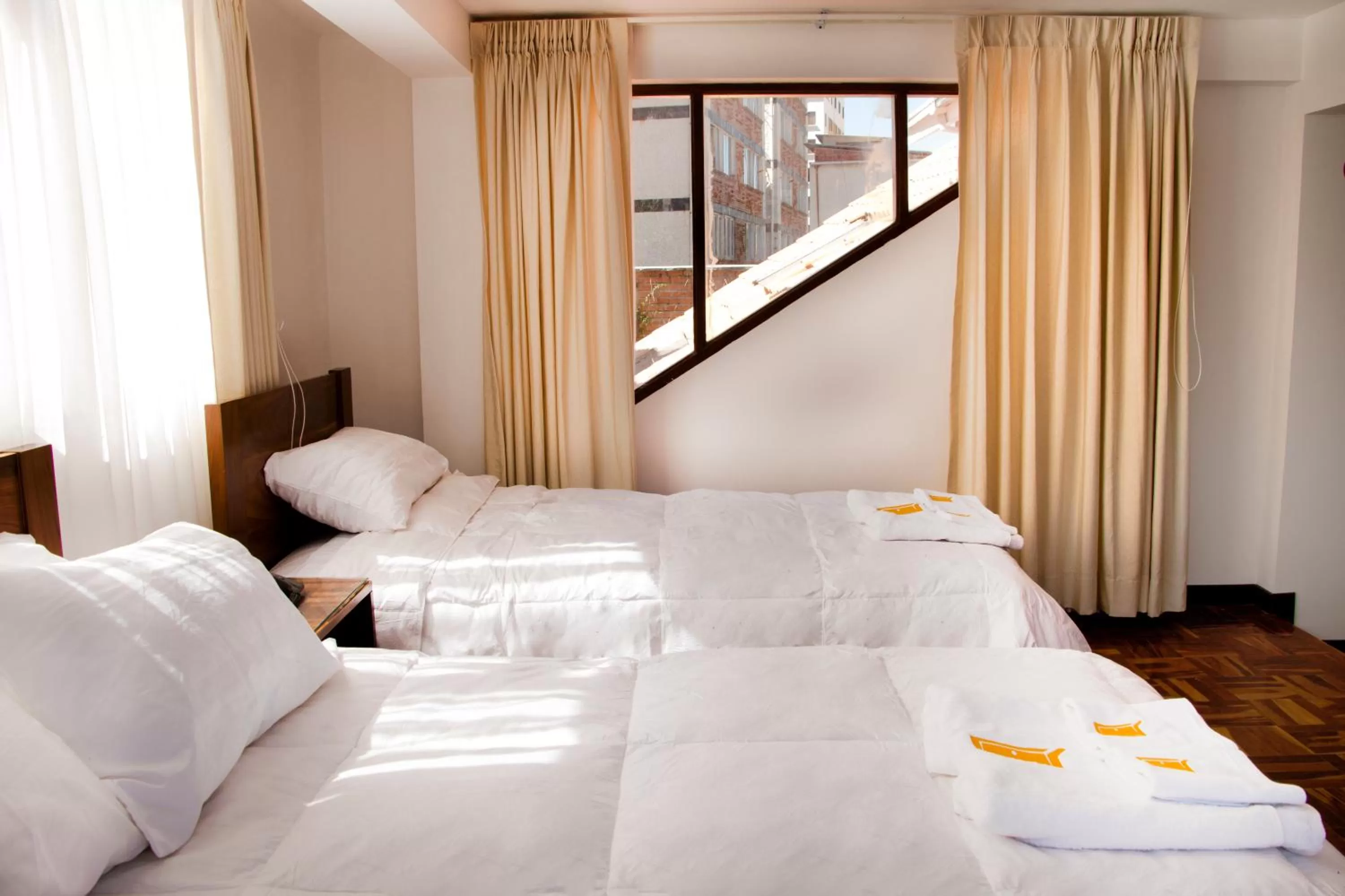 Bedroom in Qhini Hotel Boutique