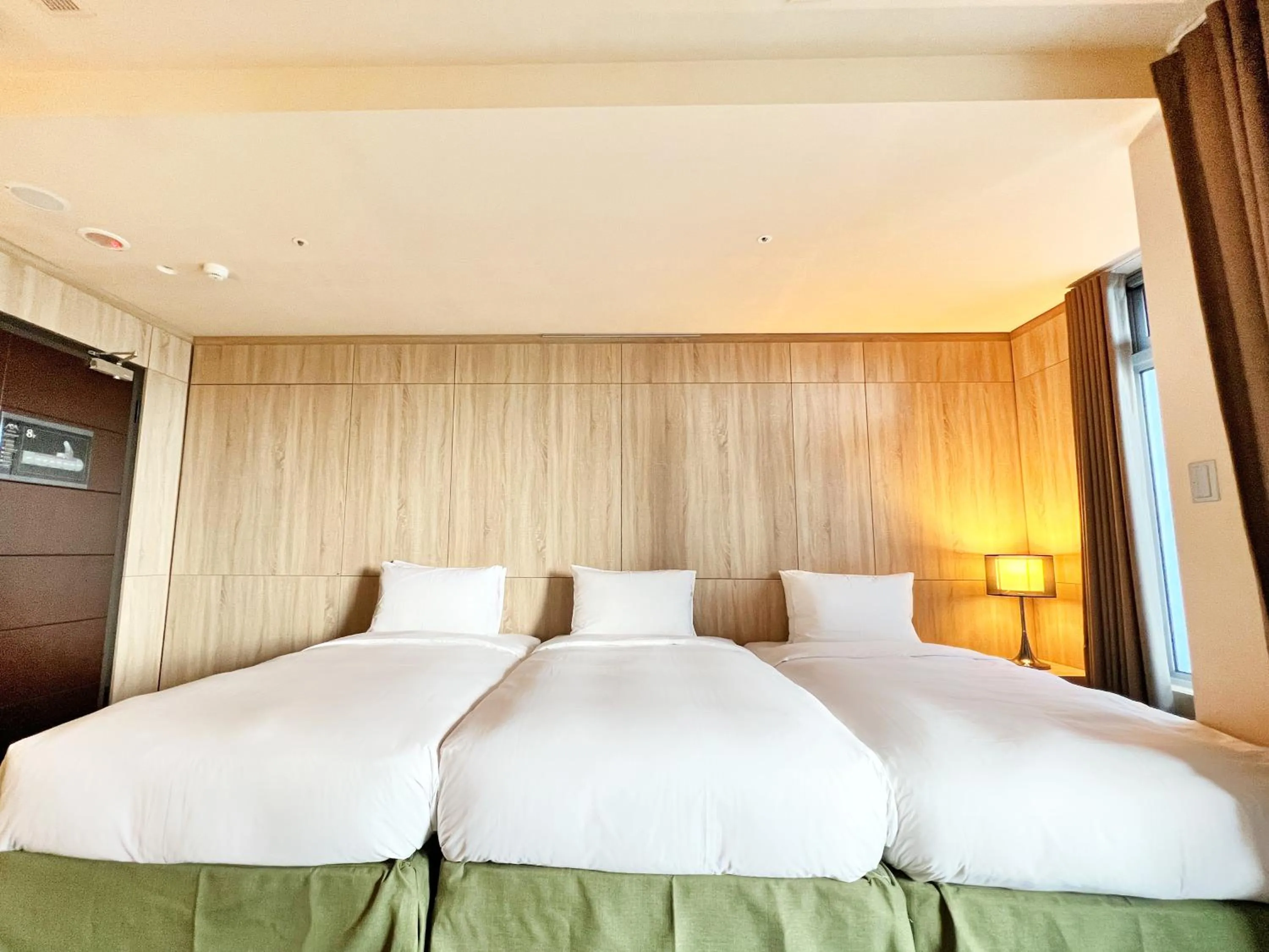 Bed in Wallsun Hotel