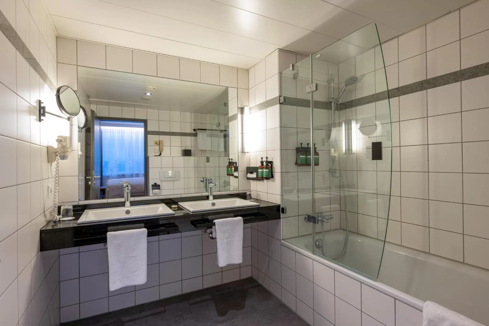 Bathroom in voco Dusseldorf Seestern by IHG