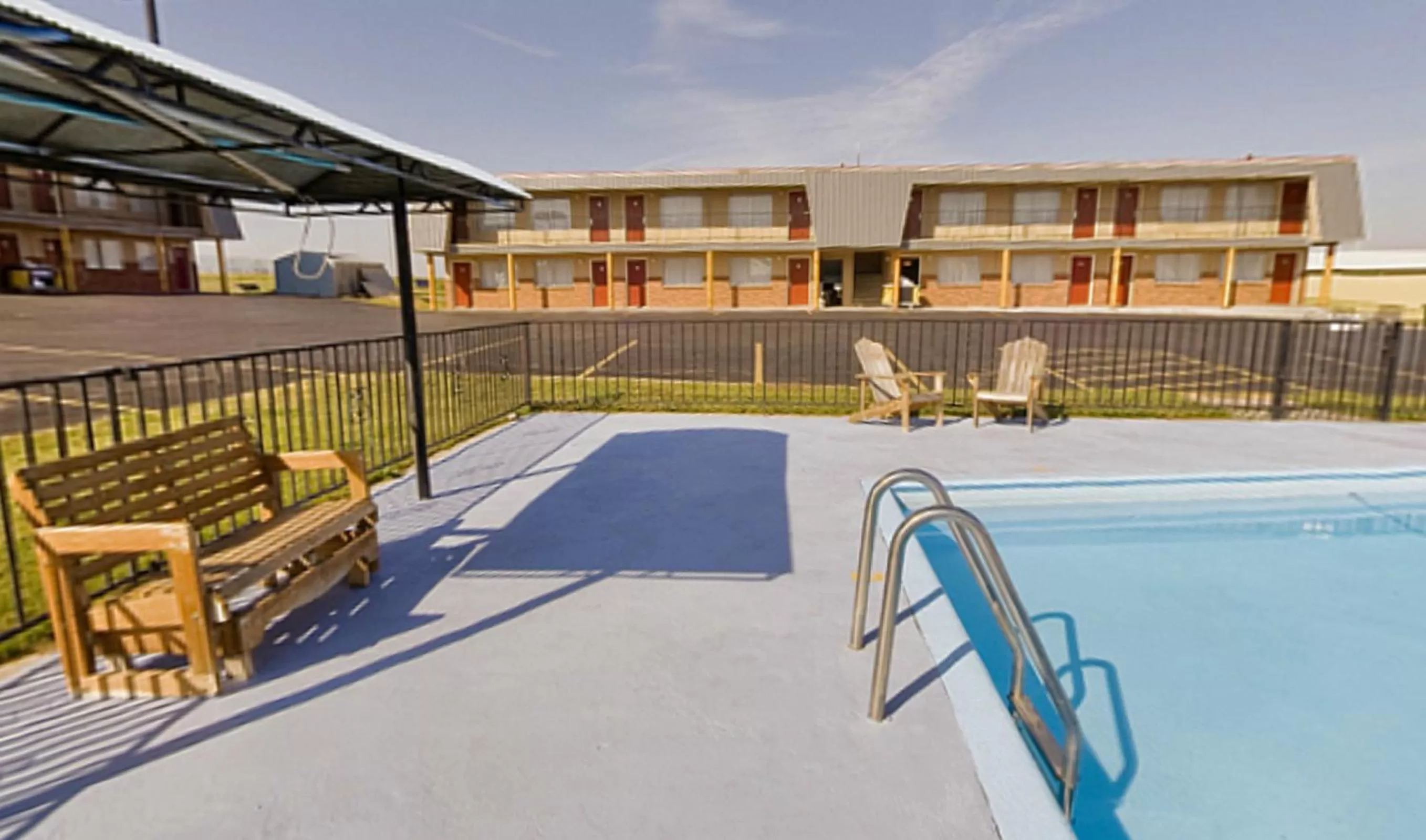 Property building in Americas Best Value Inn Wall