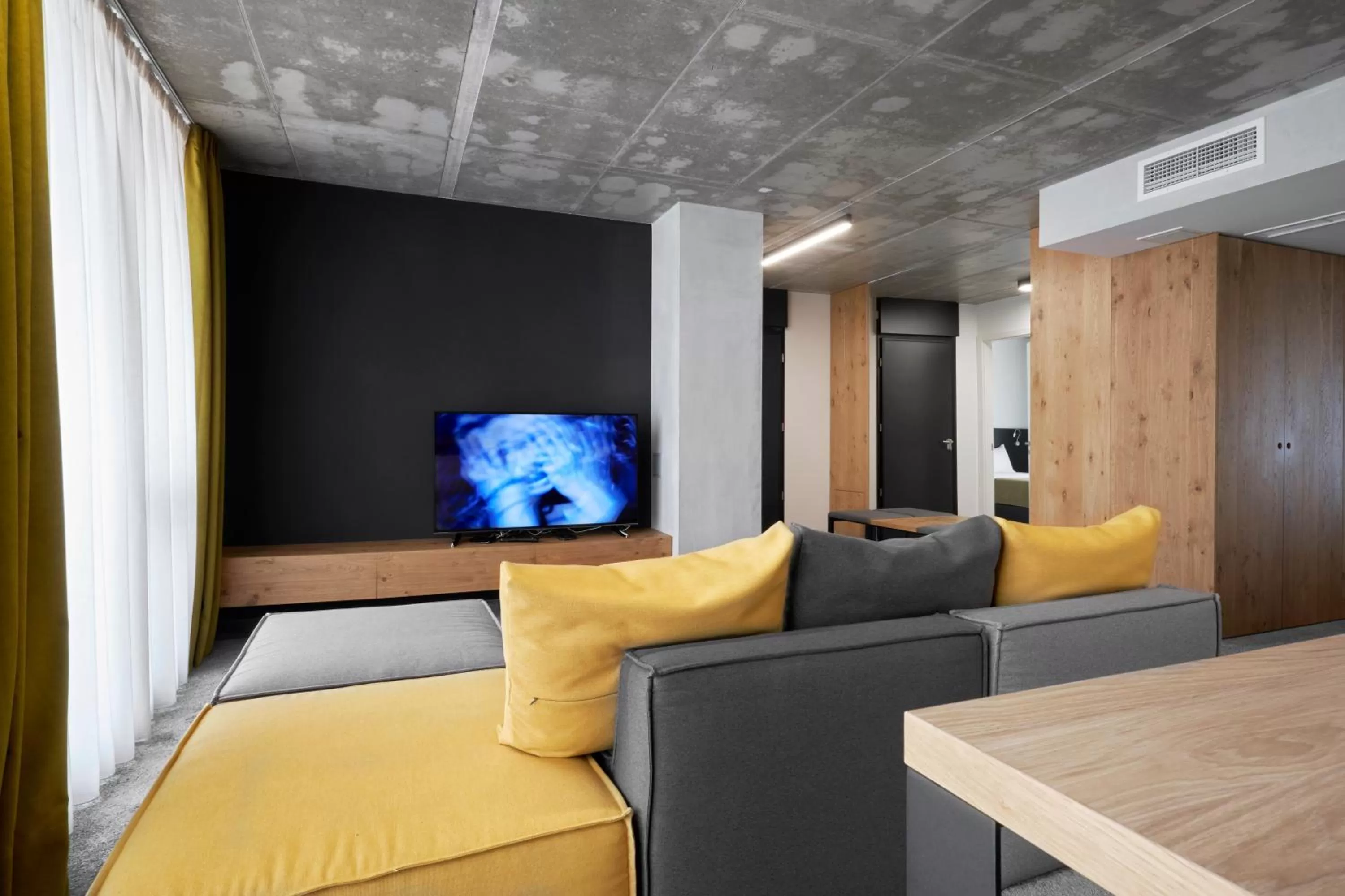 Communal lounge/ TV room in Adella Boutique Hotel - Free Secured Parking