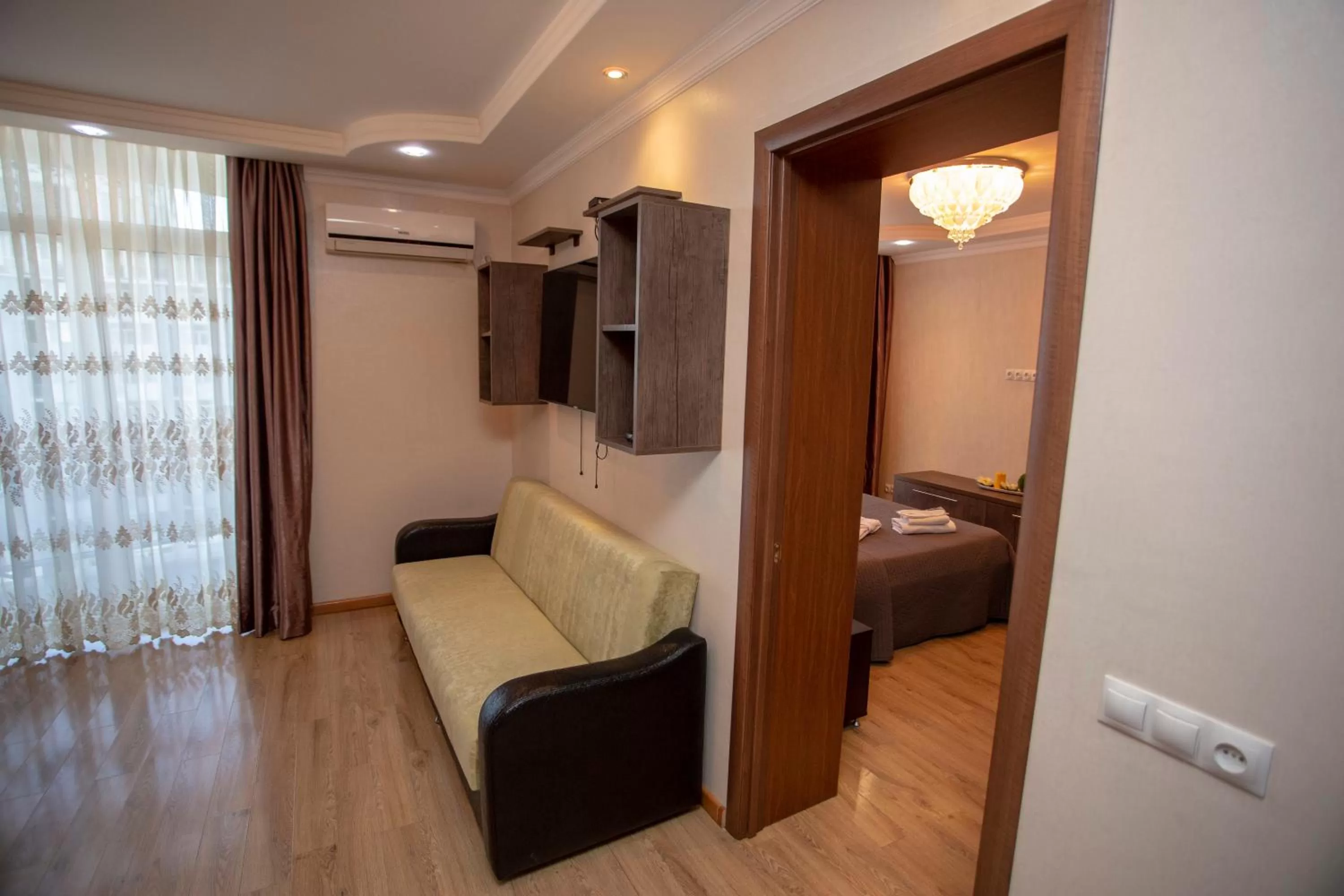 Seating area, Bed in Blue Star Batumi