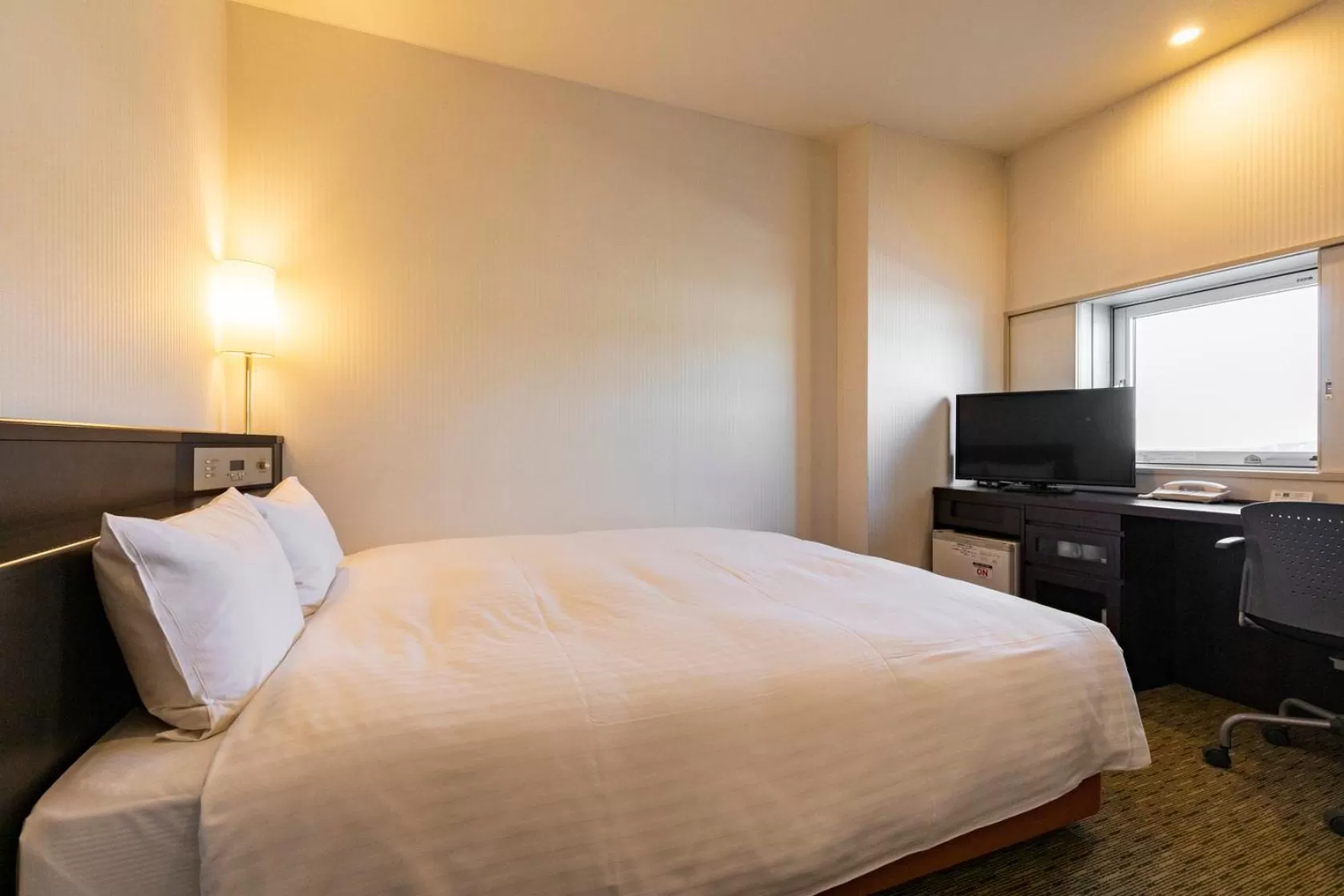 Photo of the whole room, Bed in Nishitetsu Inn Kurosaki