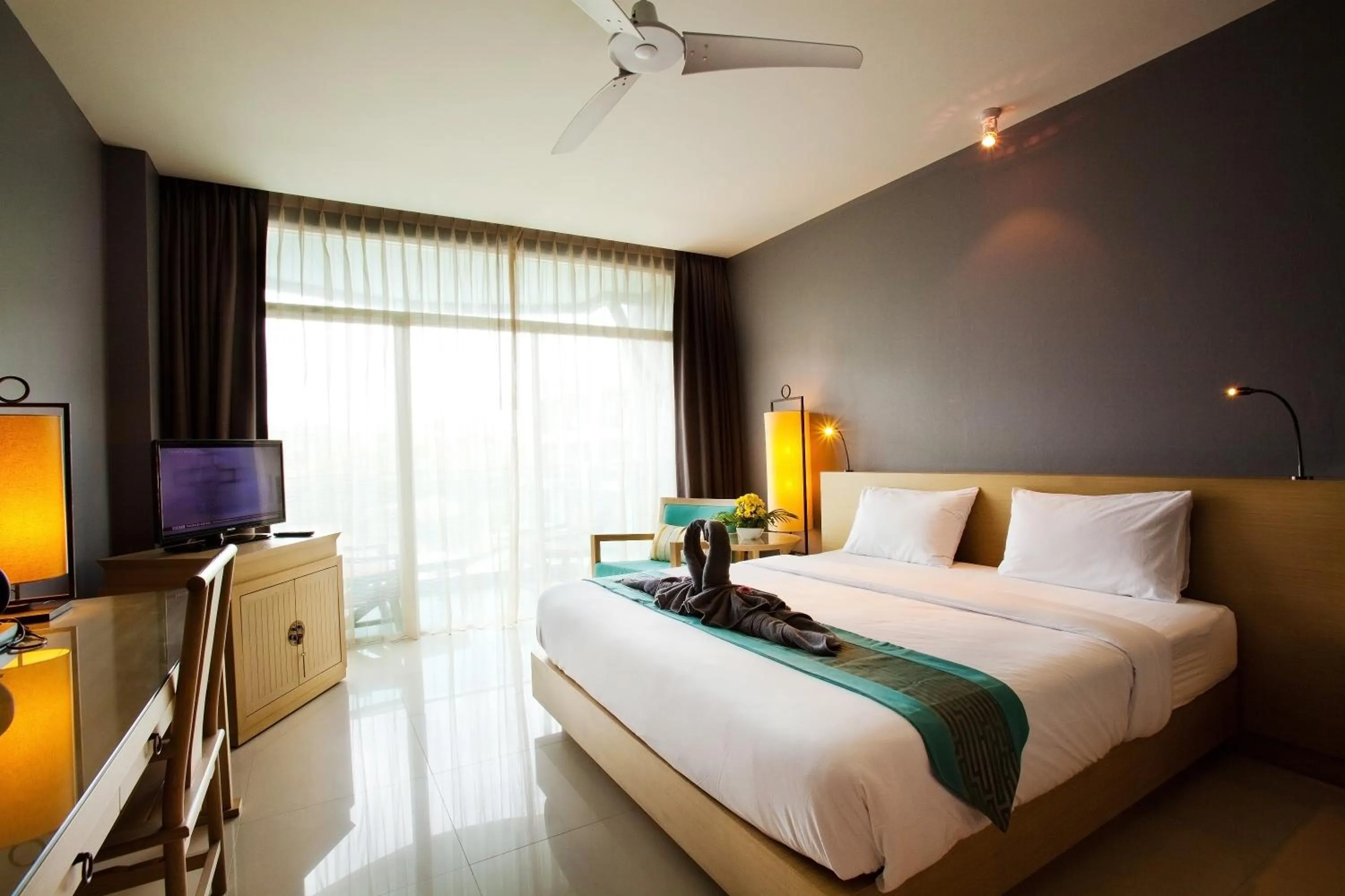 Photo of the whole room, Bed in Ramaburin Resort Patong - SHA Extra Plus