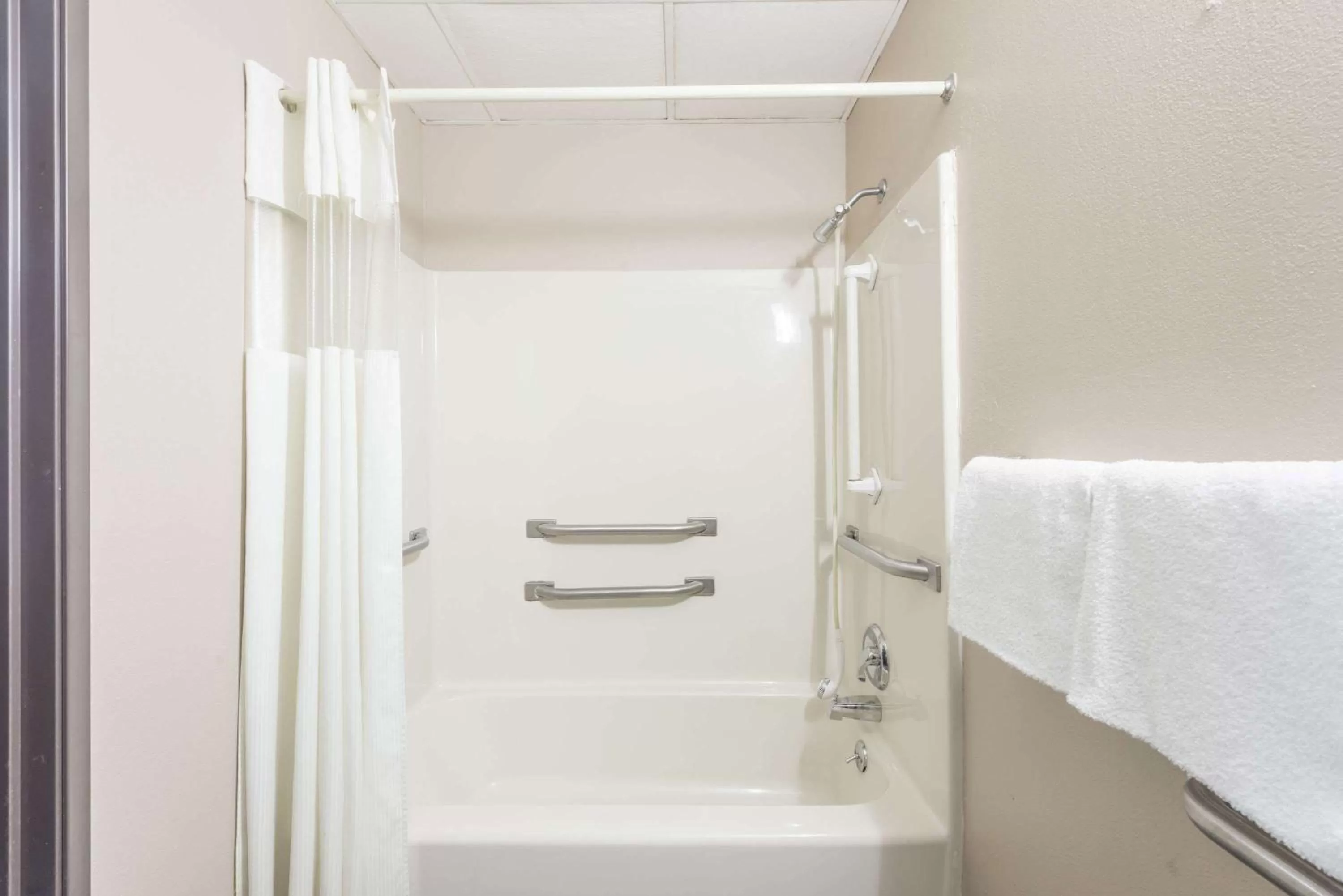 Bathroom in Super 8 by Wyndham O'Fallon MO/St. Louis Area