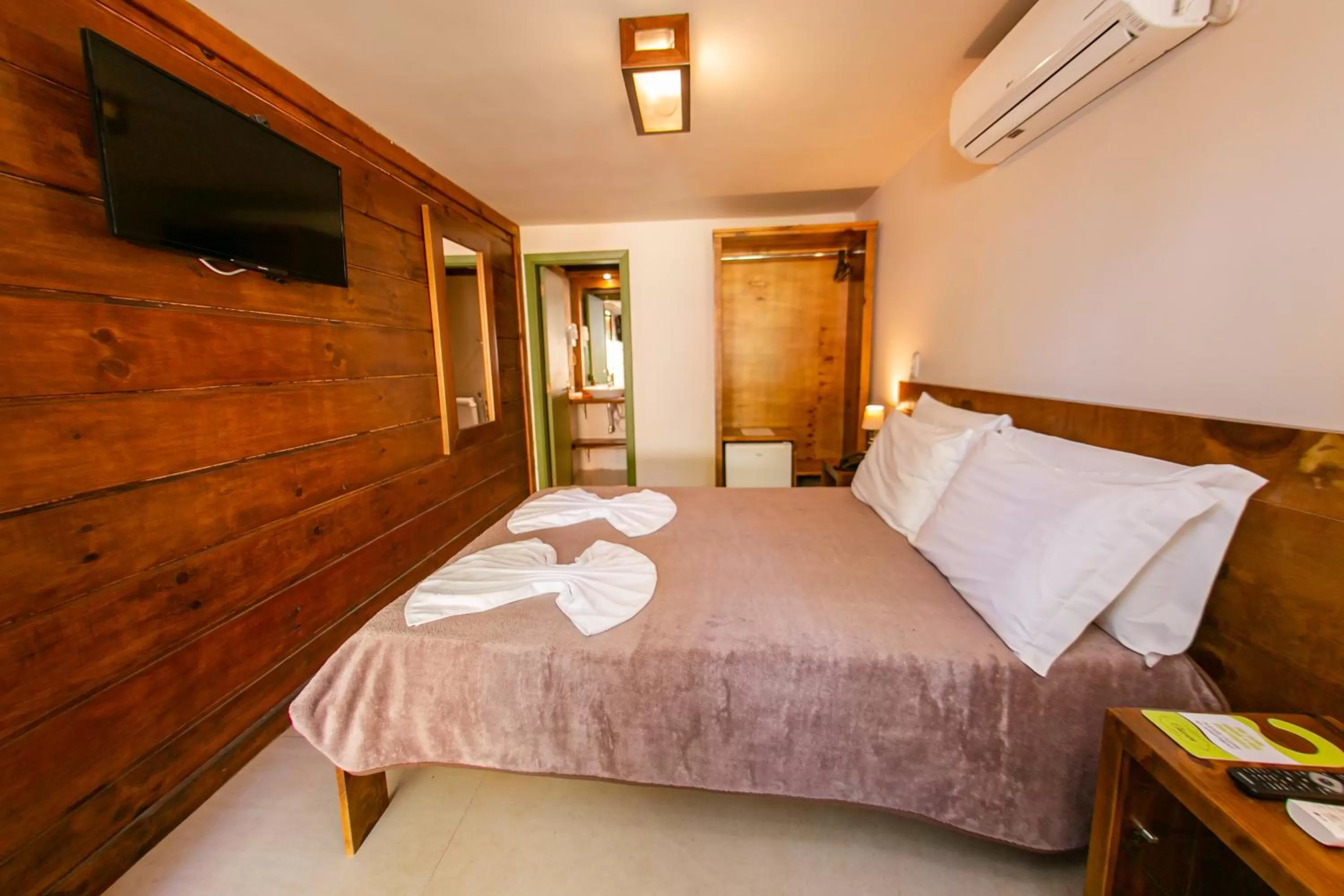 Bed in Pousada Charm Canela