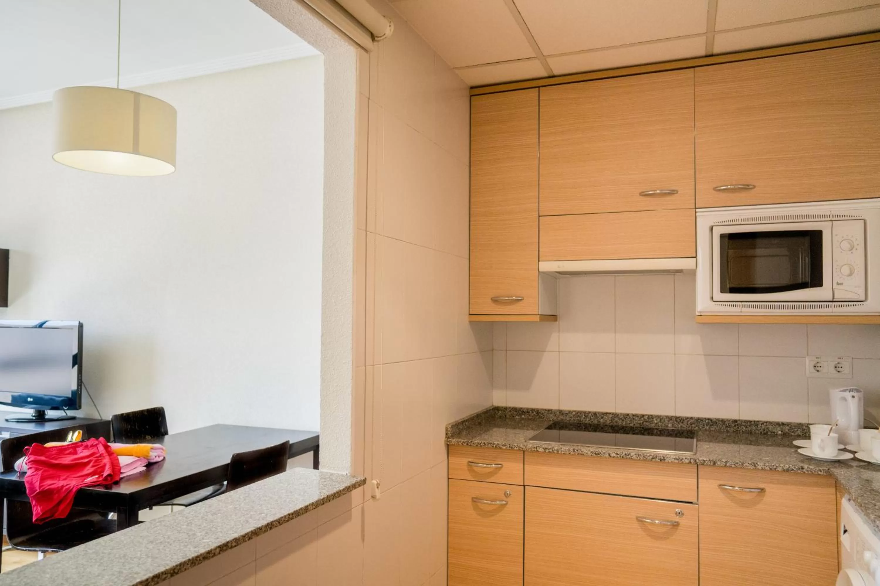Kitchen or kitchenette in Compostela Suites