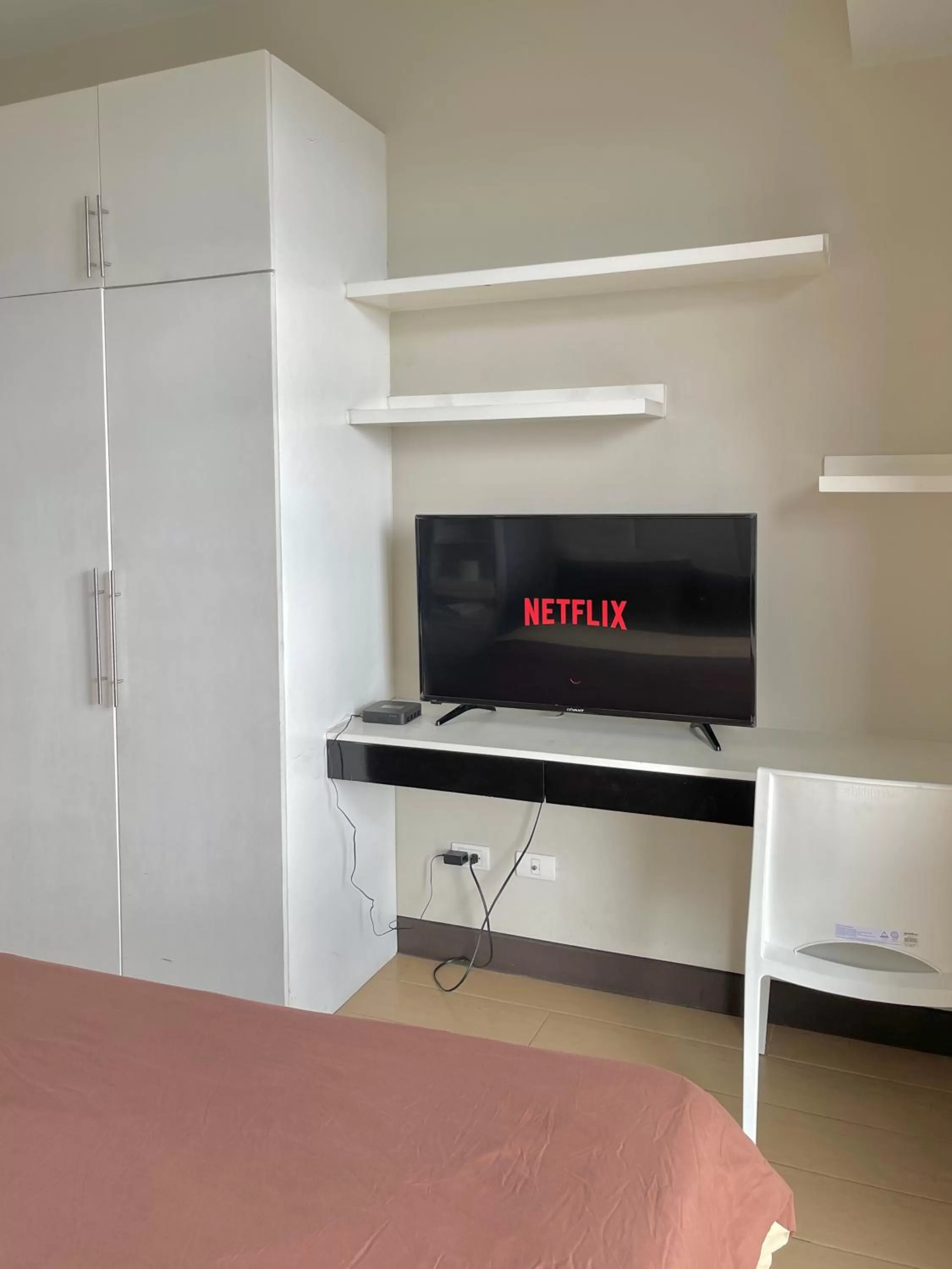 Bed, TV/Entertainment Center in Cubao, Quezon City Condo Staycation (wifi and netflix ready)