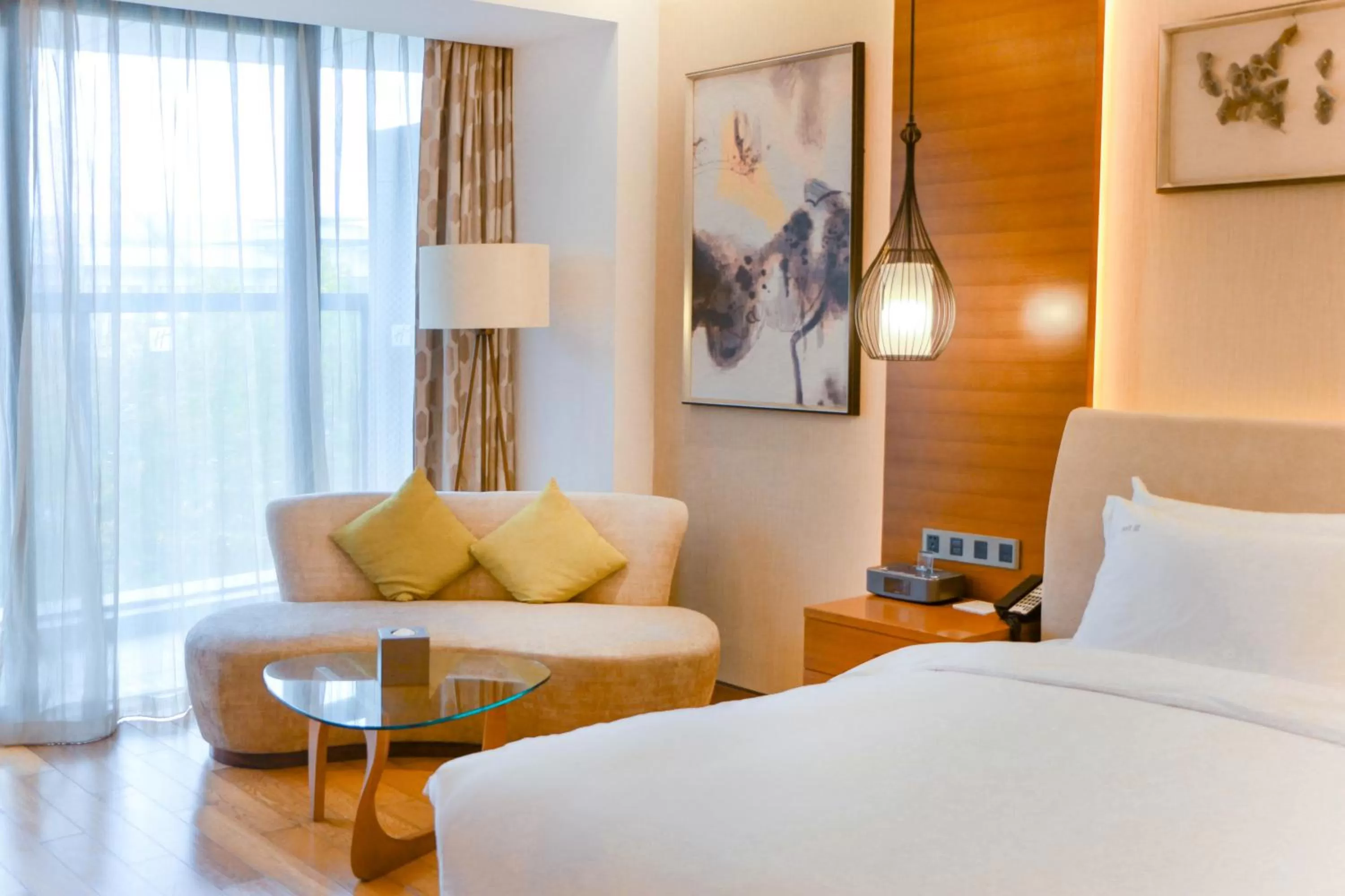Living room, Bed in Holiday Inn Nanjing Xuanwu Lake by IHG