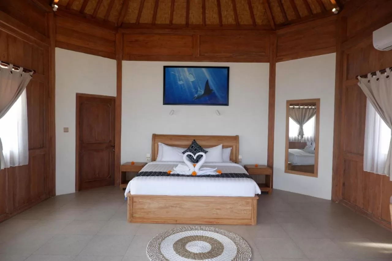 Bed in Blue Harbor Beachfront Villas & Resto