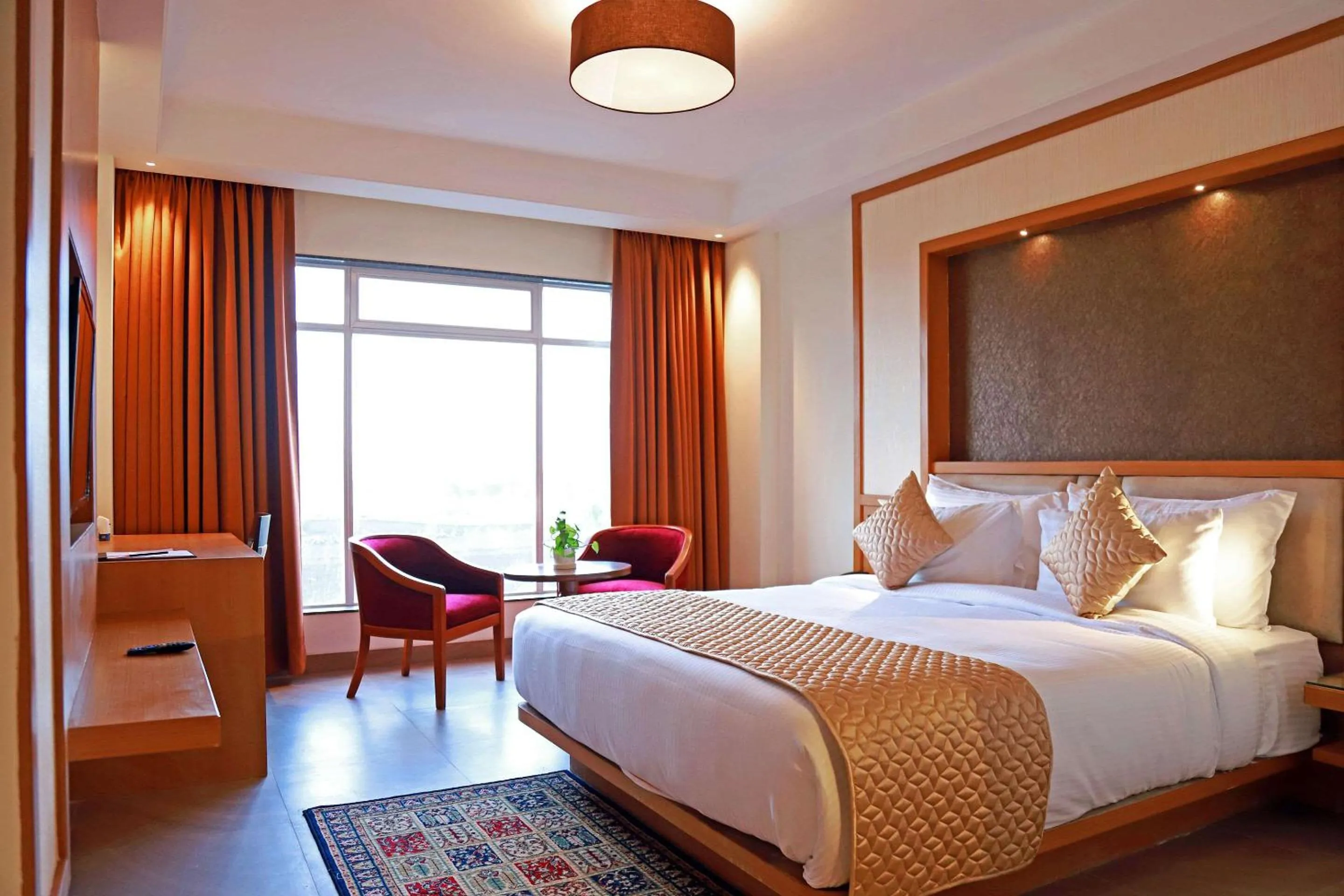 Photo of the whole room, Bed in Clarion Inn Indore