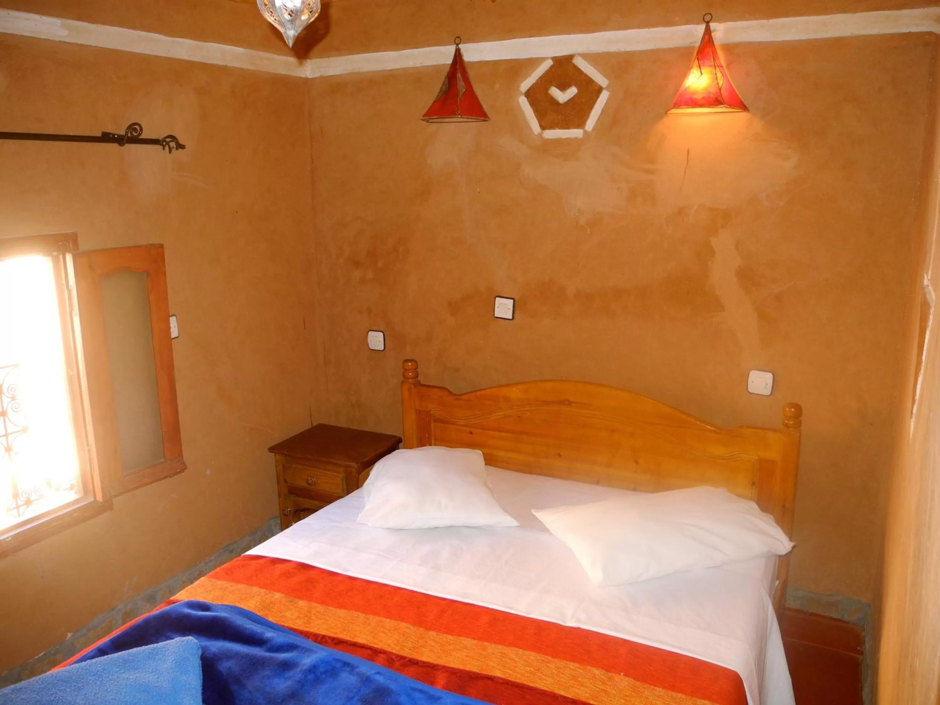 Bed in Maison d'Hôte Valentine