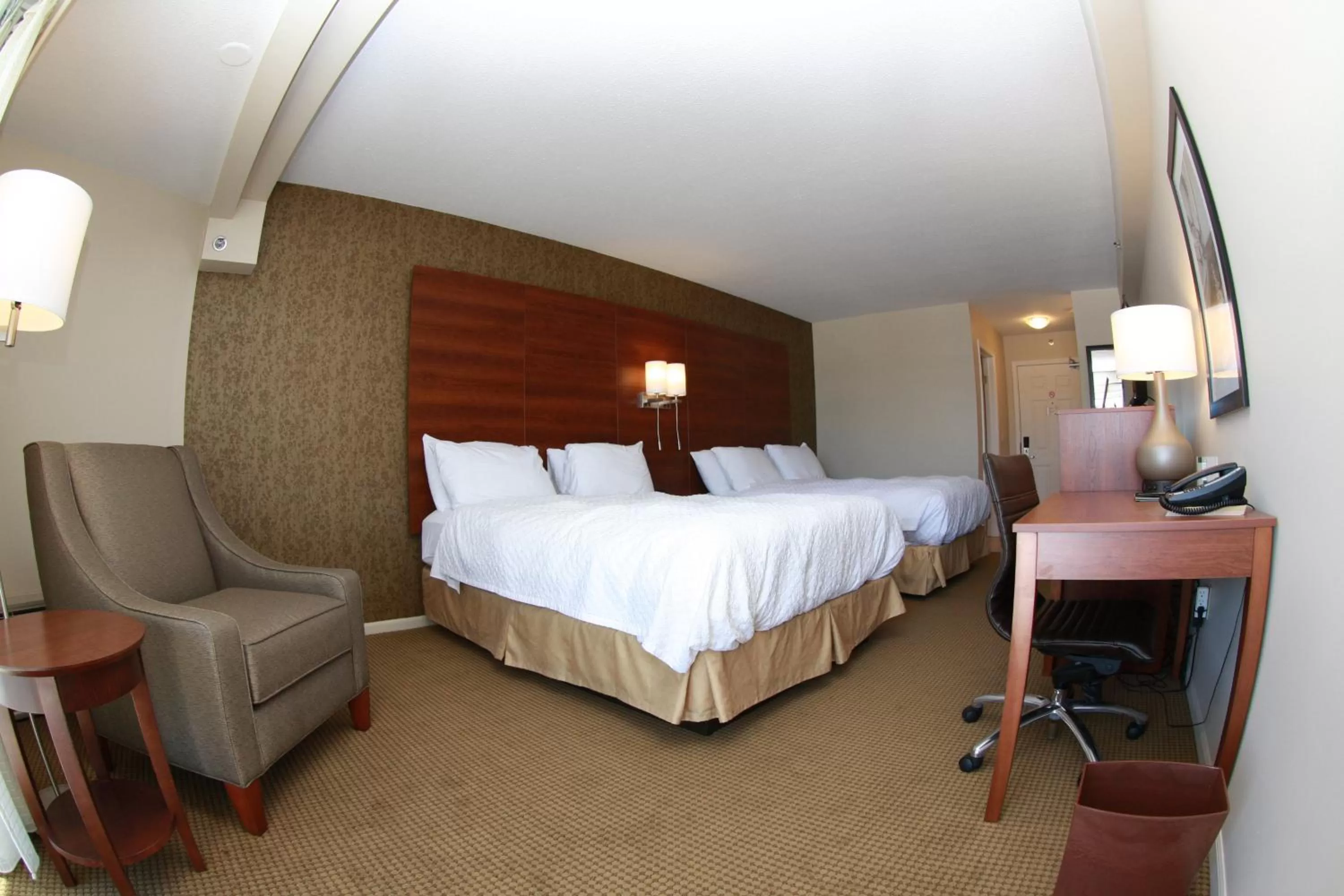 Bed in Budget Host Inn & Suites