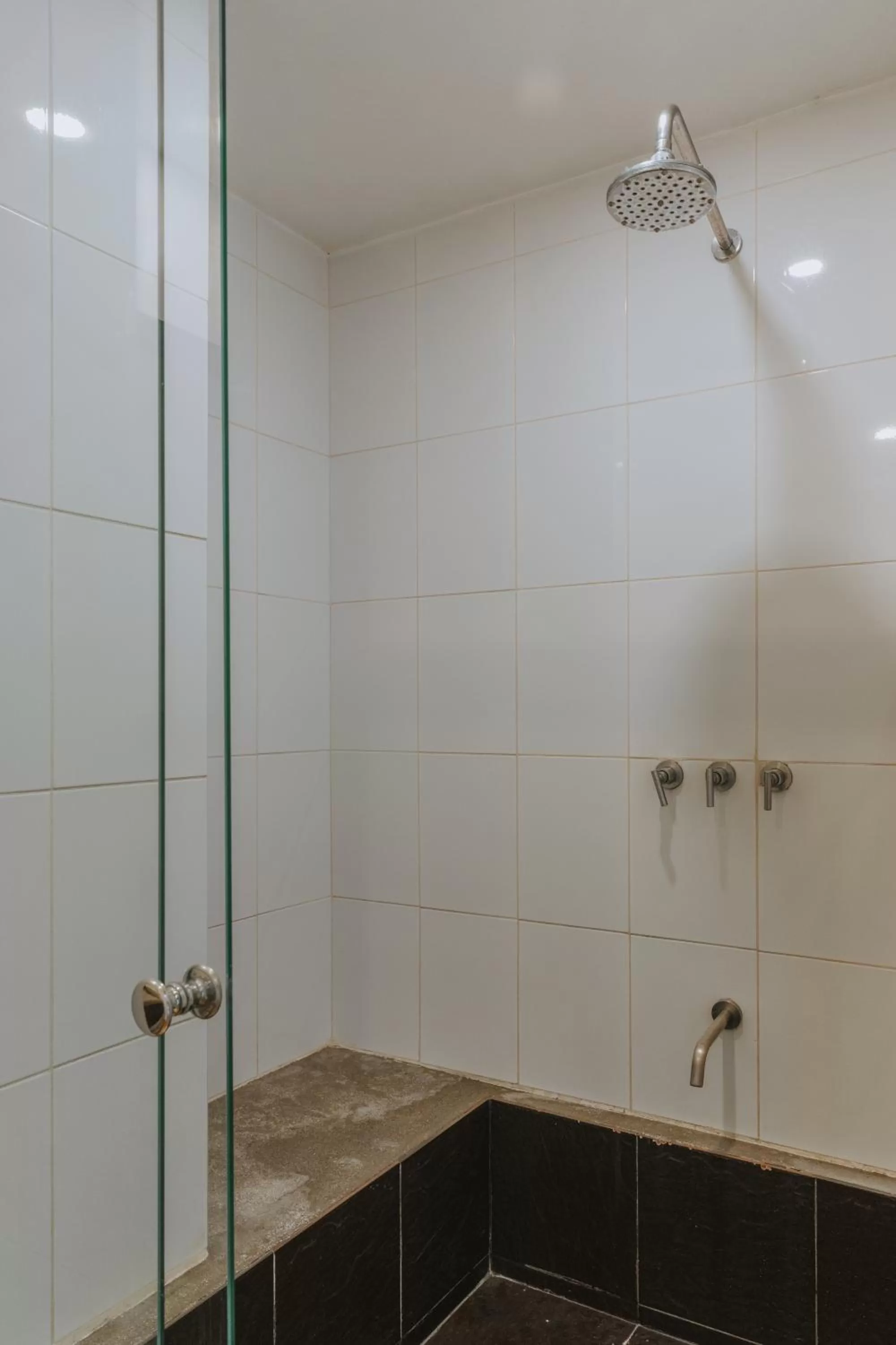 Shower in Travelers Orange Suites