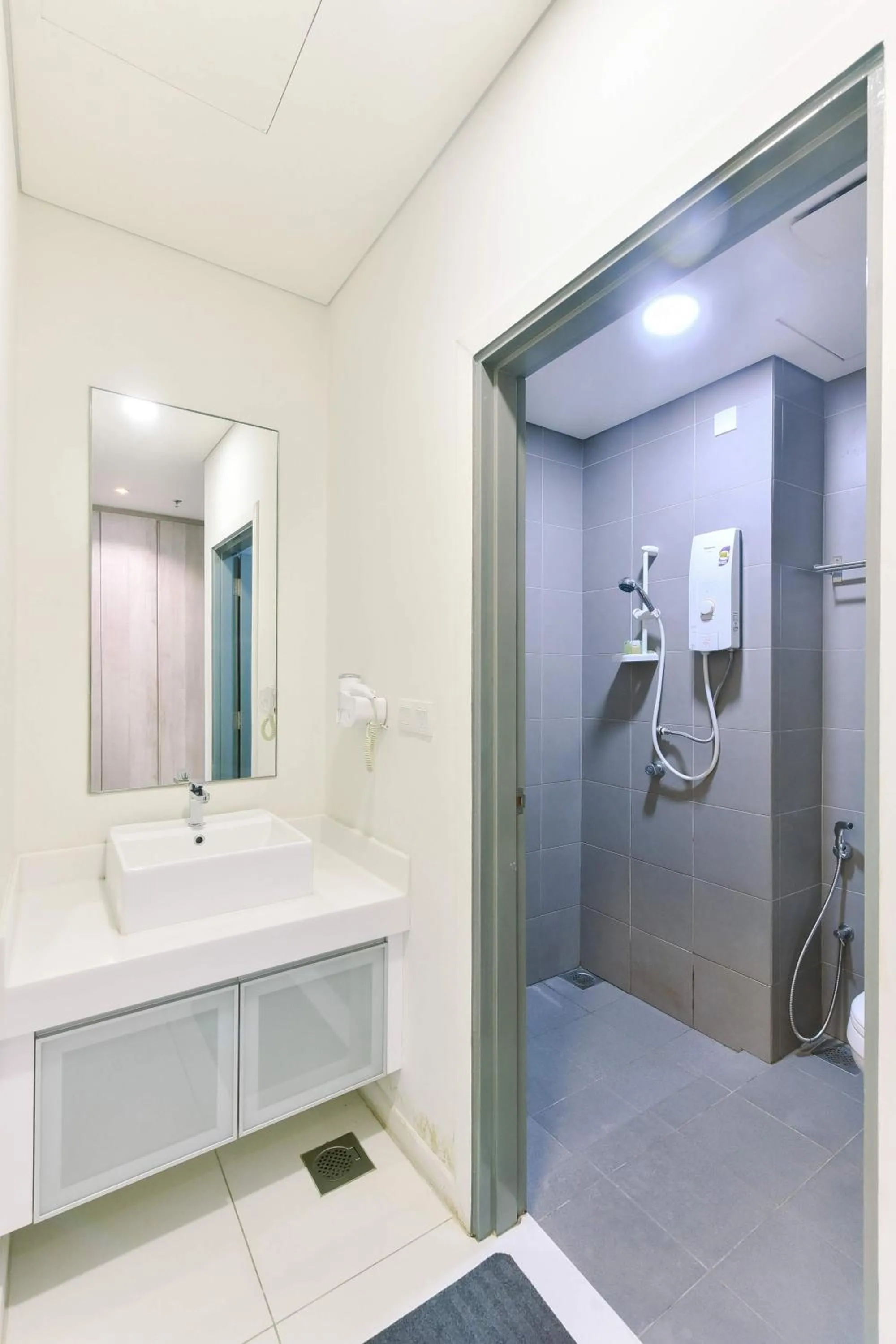 Bathroom in Summer Suites Residences by Subhome