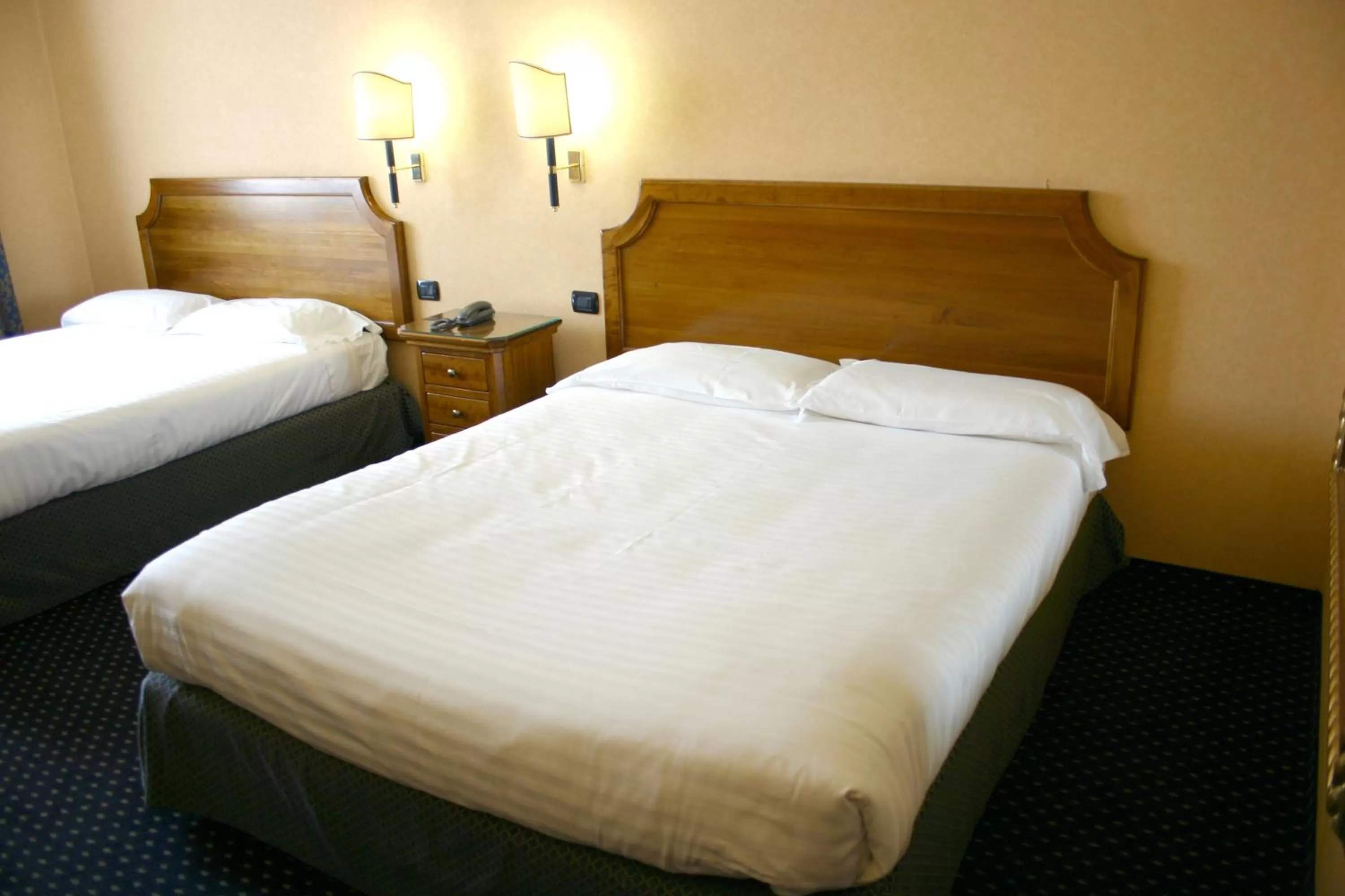 Bed in Hotel Don Carlo