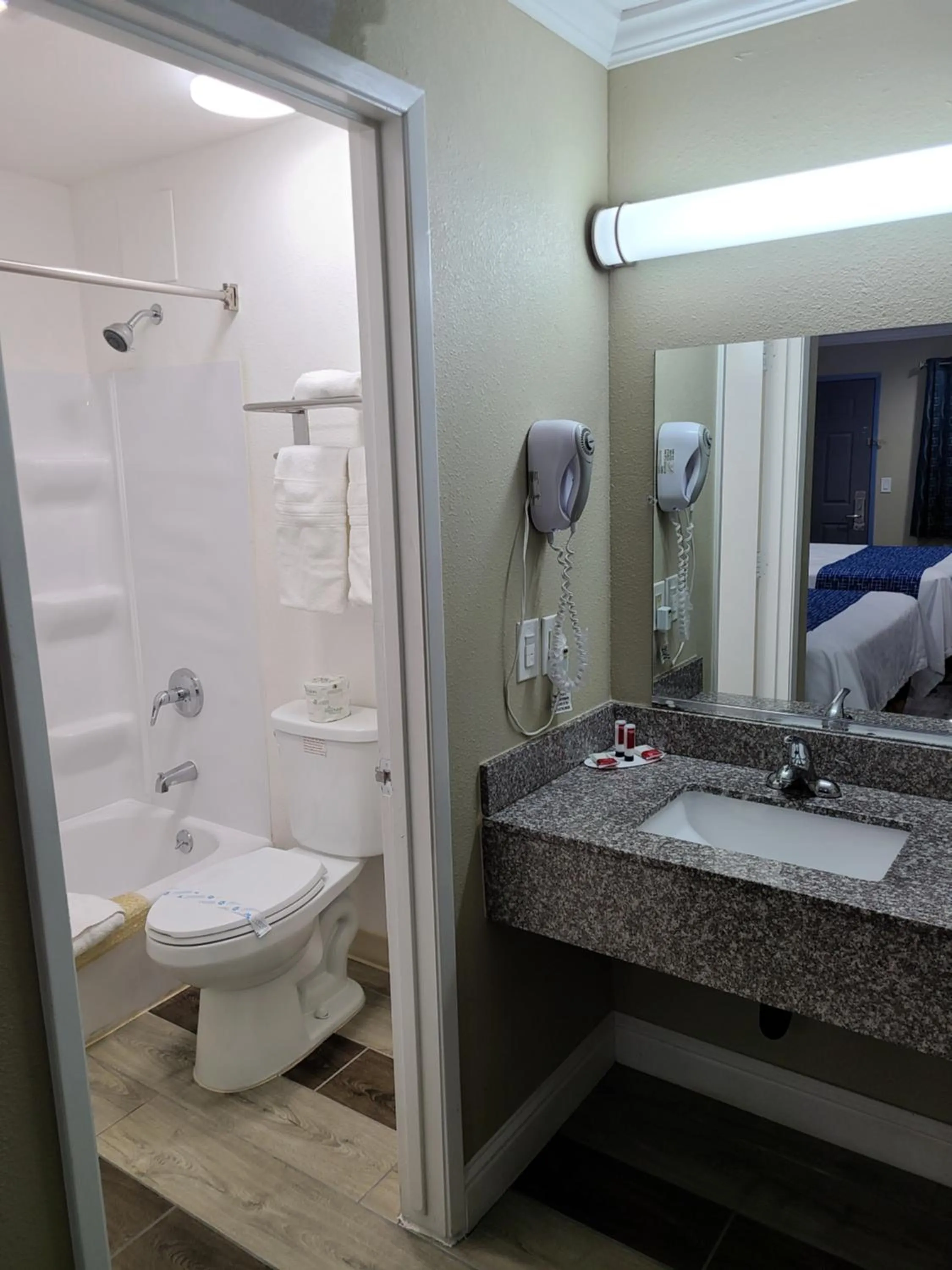 Bathroom, Bed in Travelodge by Wyndham Clearlake