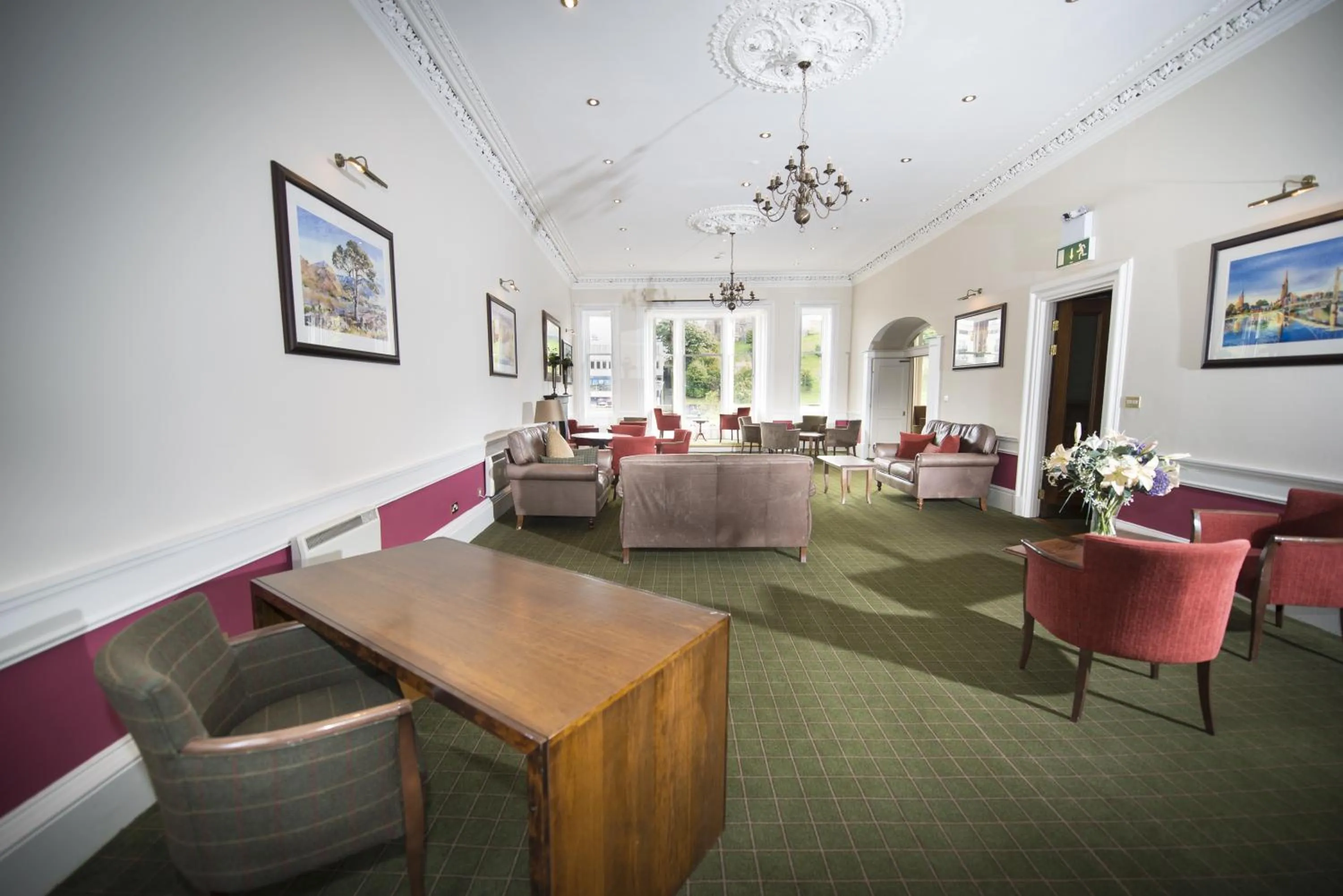 Communal lounge/ TV room in Columba Hotel Inverness by Compass Hospitality