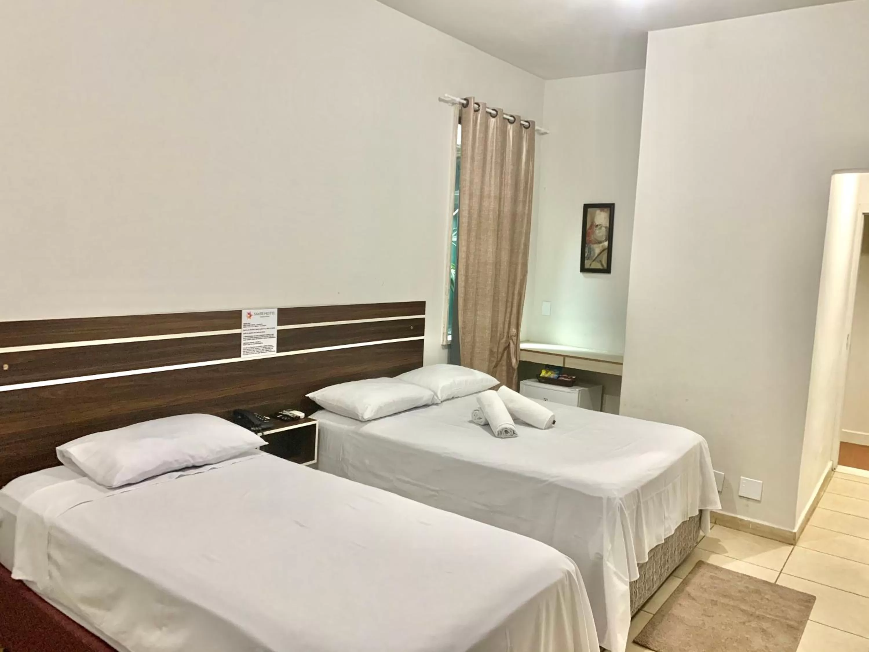 Bed in SAMIR HOTEL COMFORT