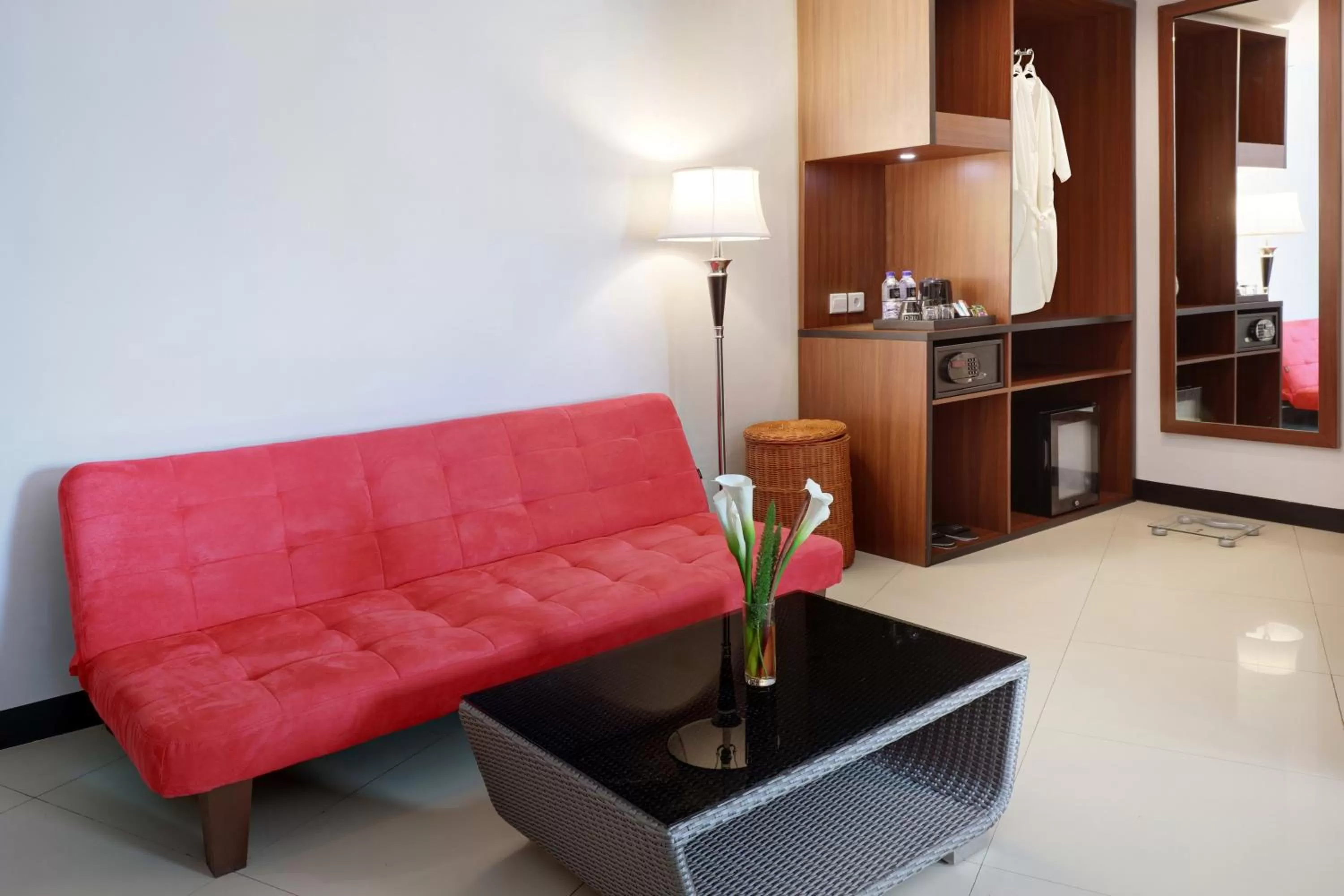 Seating area in Hotel Neo Palma Palangkaraya by ASTON