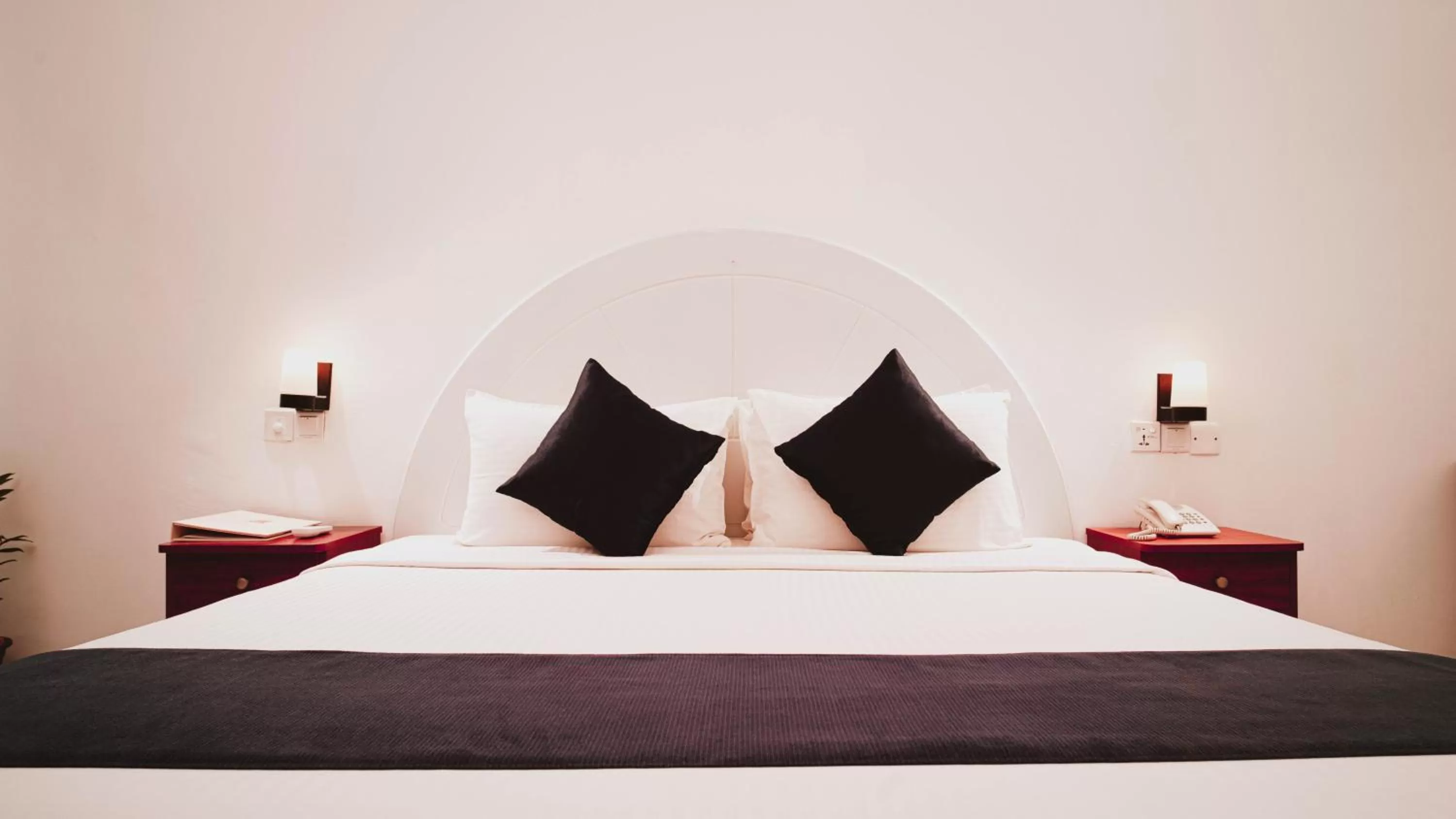 Bed in Camelot Beach Hotel