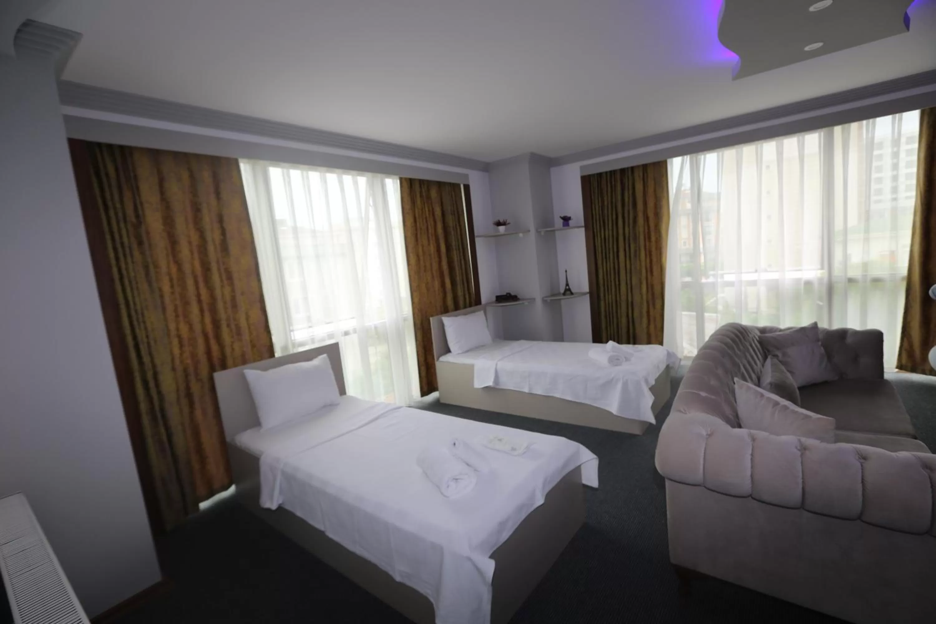 Bed in TEVETOGLU HOTEL