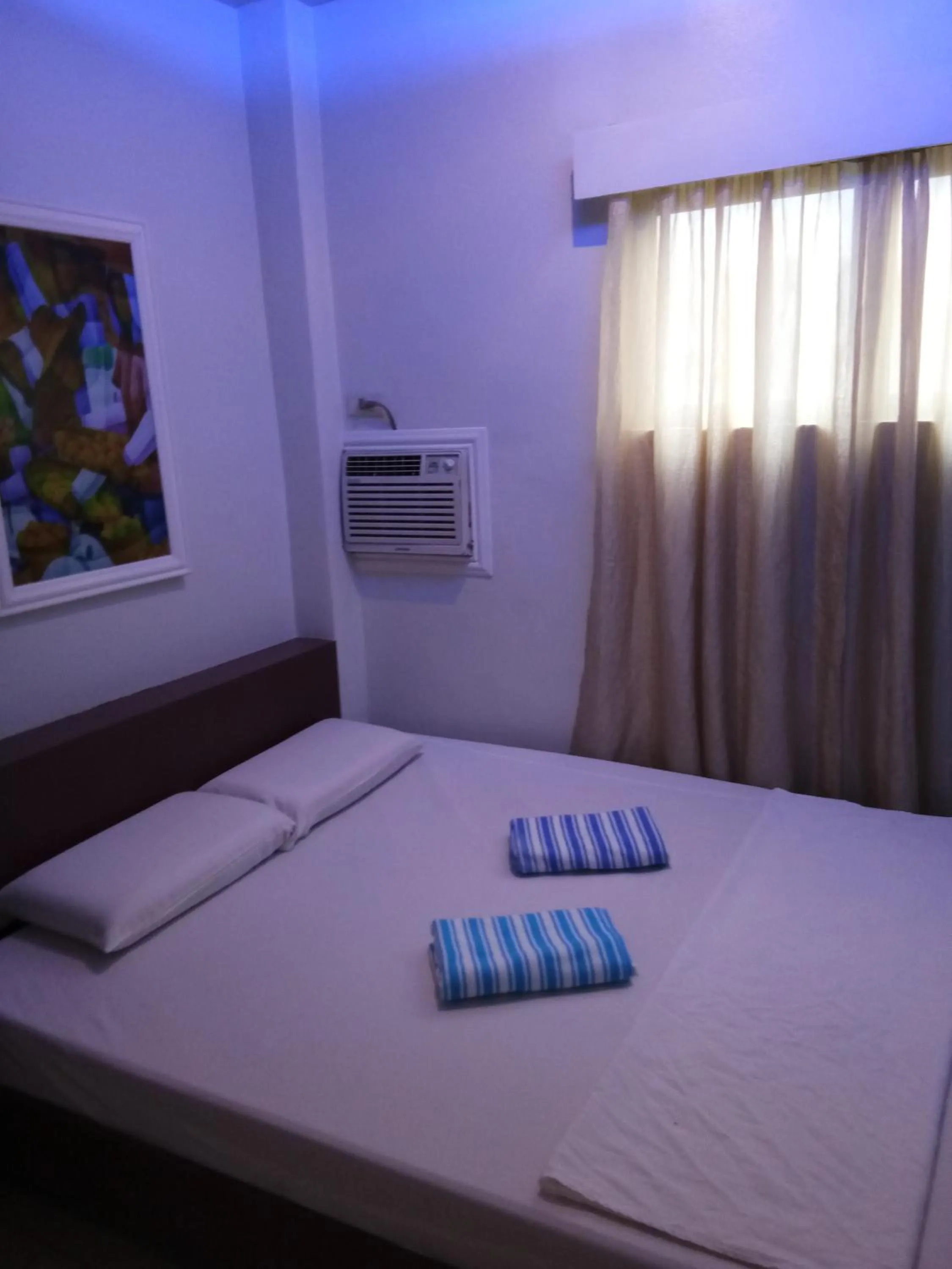 Bed in Anthurium Inn