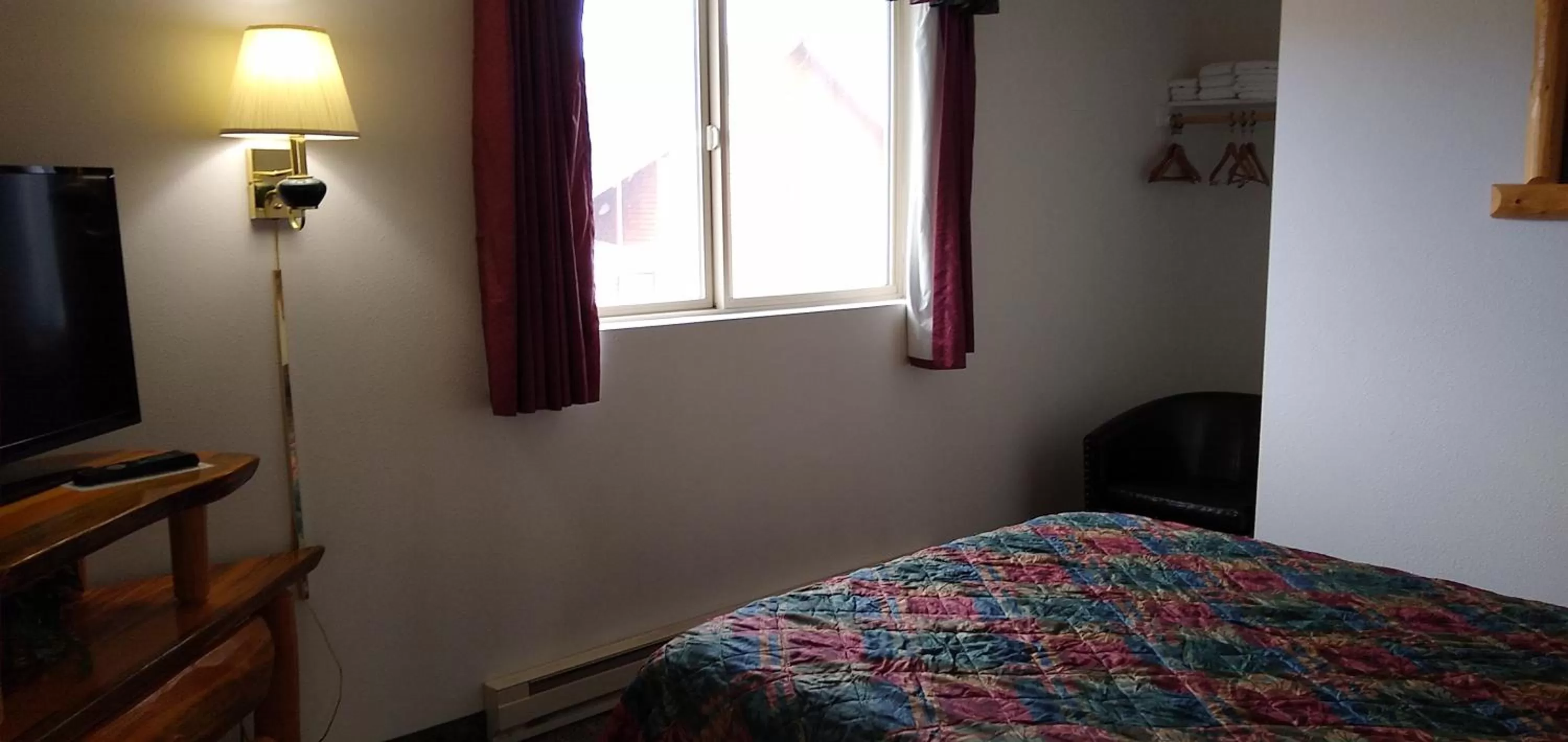 Bed in Ponderosa Motel