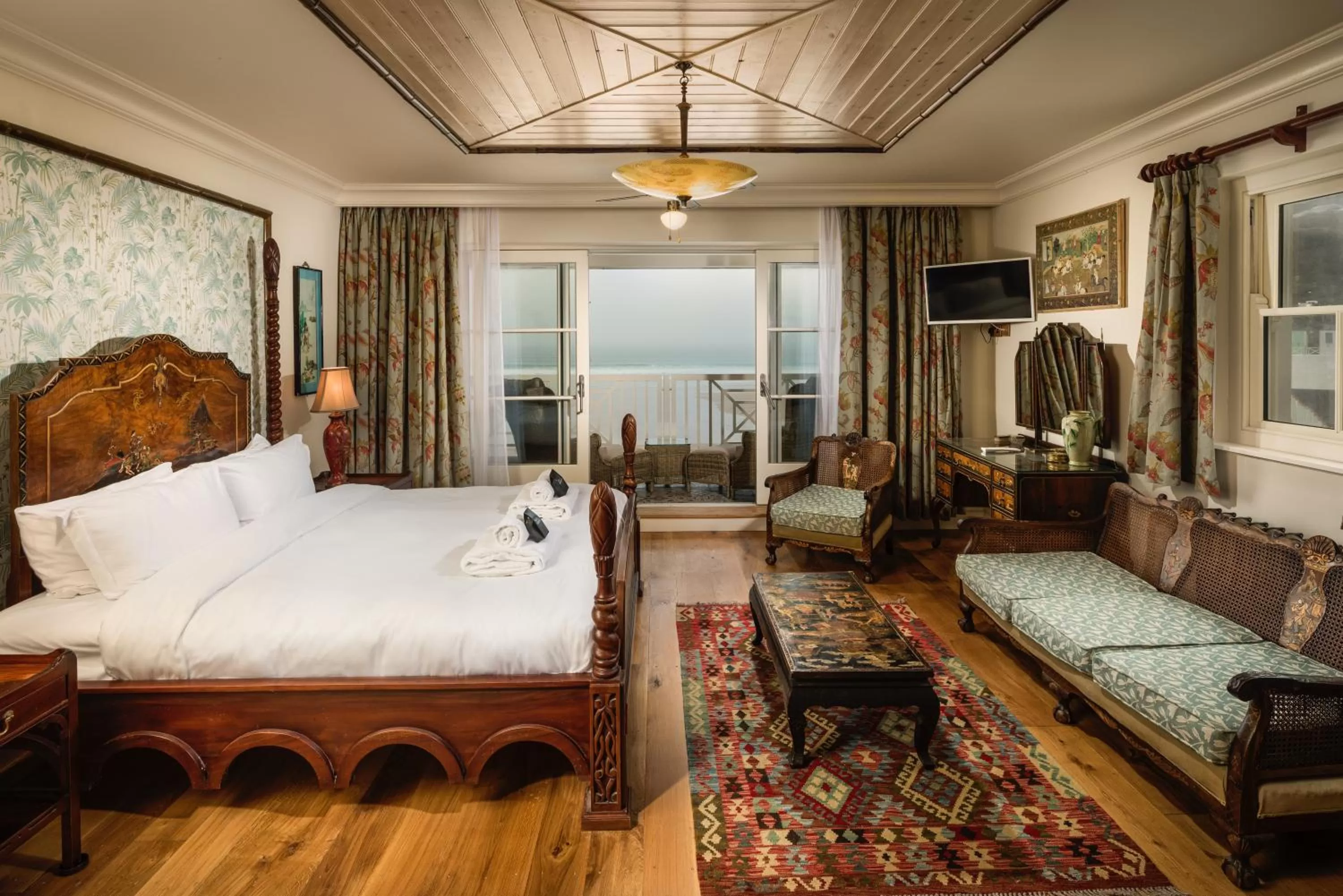 Seating area, Bed in Tolcarne Beach Colonial Restaurant and Rooms