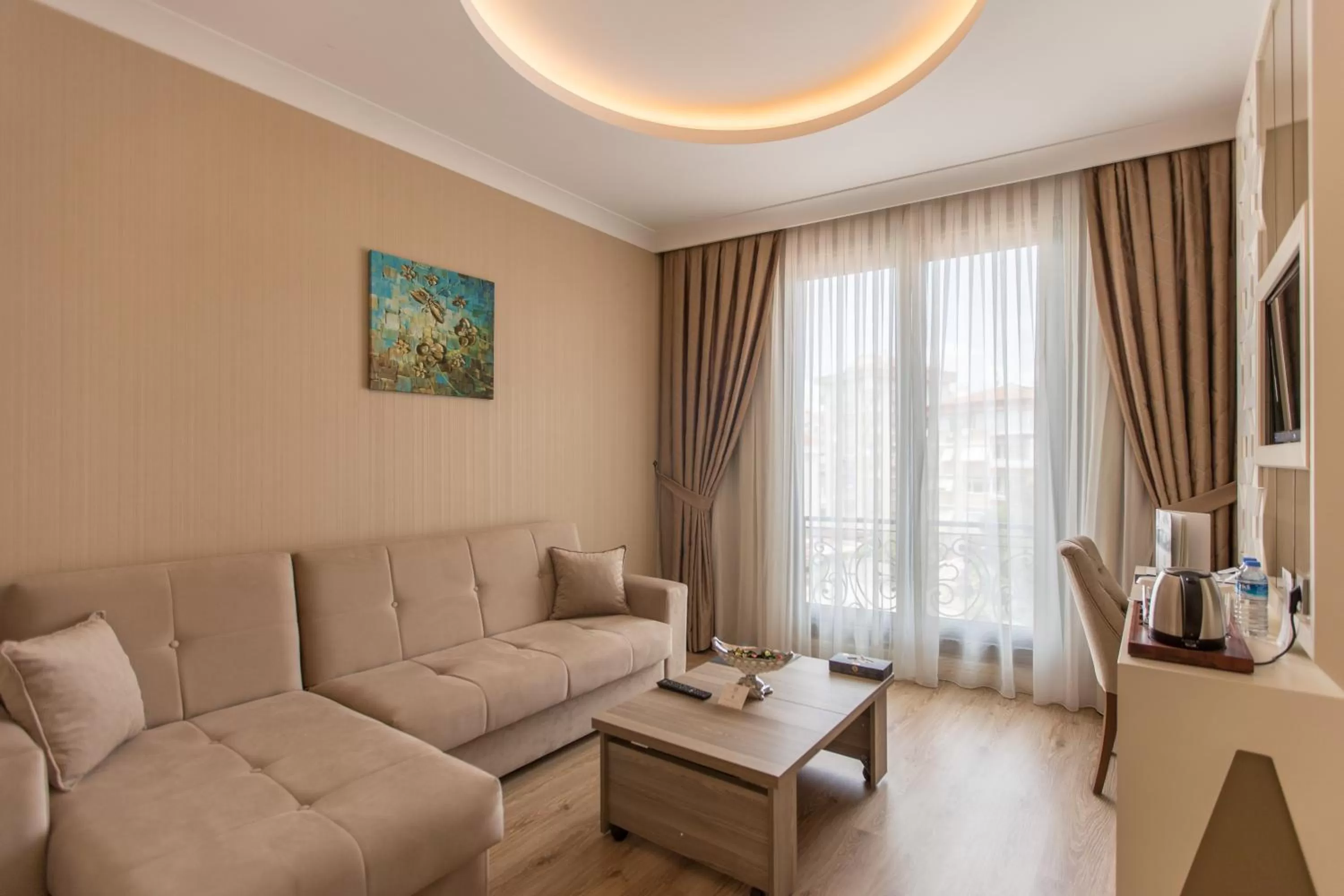 Living room in The Grand Mira Business Hotel